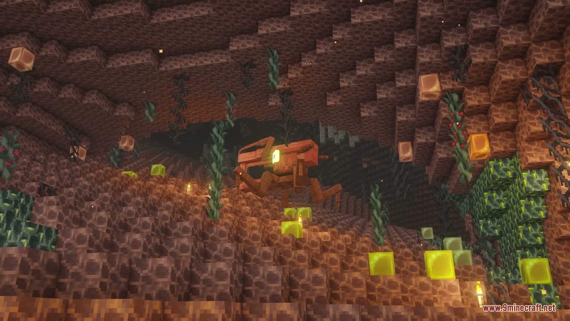 A giant insect crawls through a dark cave with glowing yellow blocks