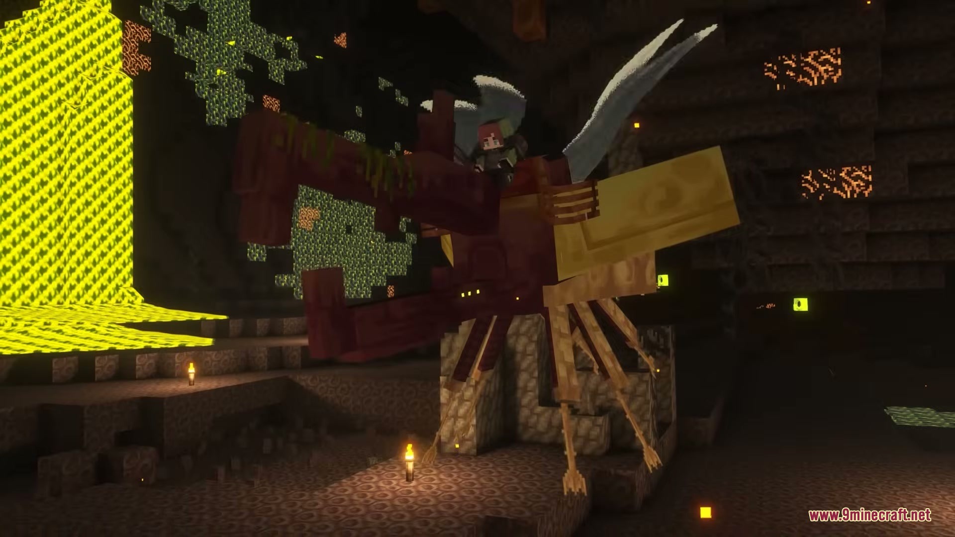 A player rides a massive red creature through a dark underground cavern
