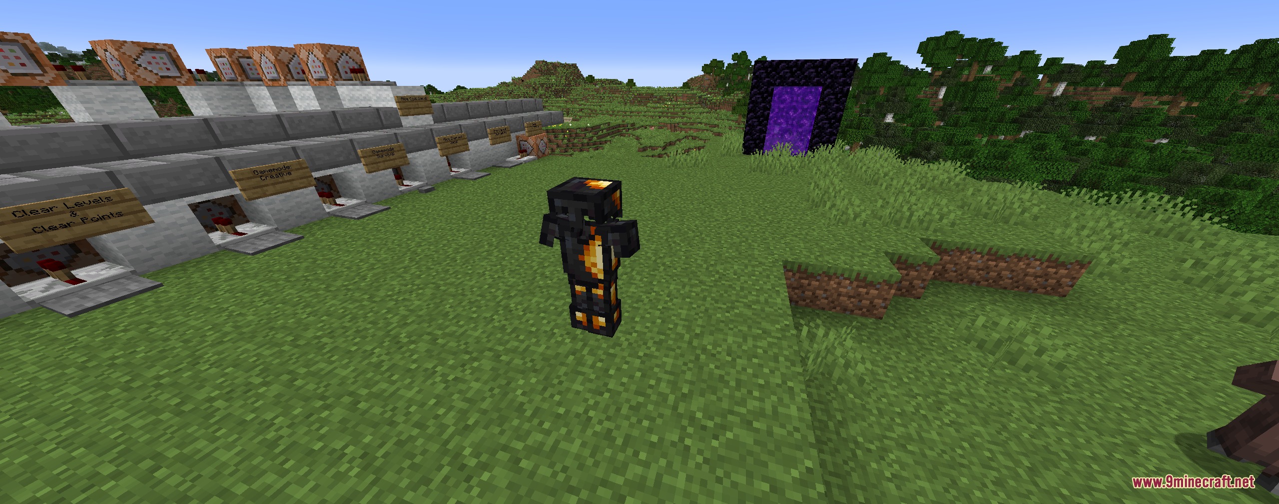 Anthracite Arsenal Mod Screenshot 1 A player wearing dark coal armor stands near a nether portal and command blocks