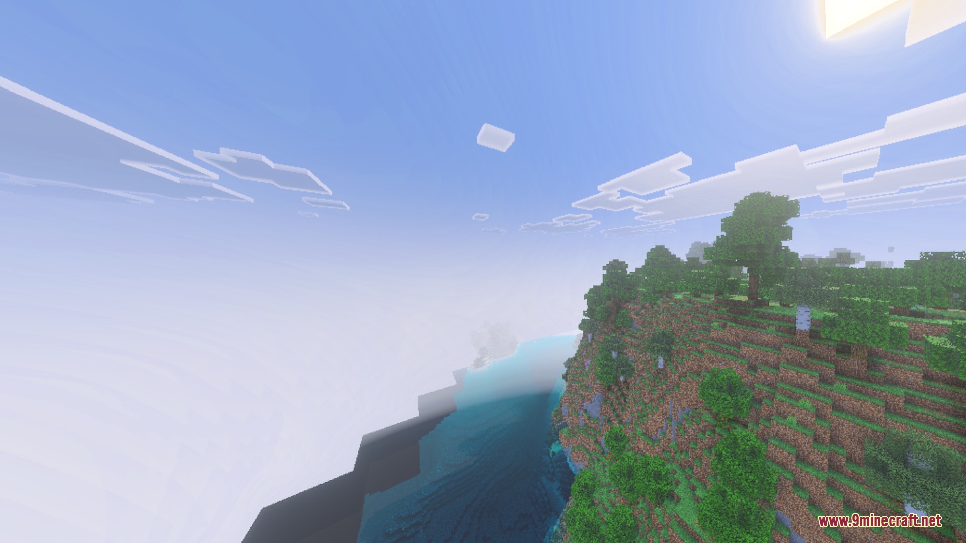 Scenic green cliff overlooking clear blue water with realistic lighting and soft fog