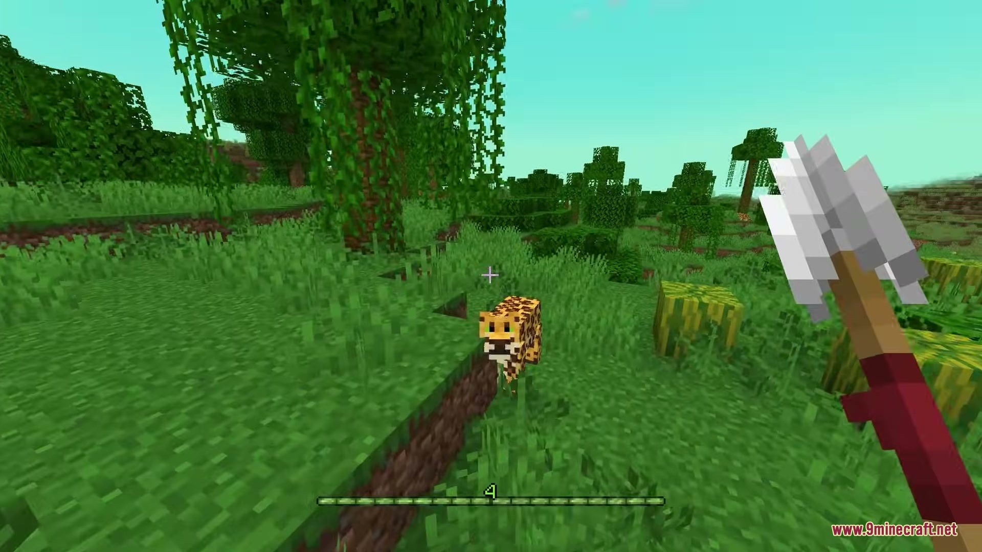 Araxer's Bestiary Mod Screenshot 4 A player aims a spear at a small spotted jaguar in the jungle