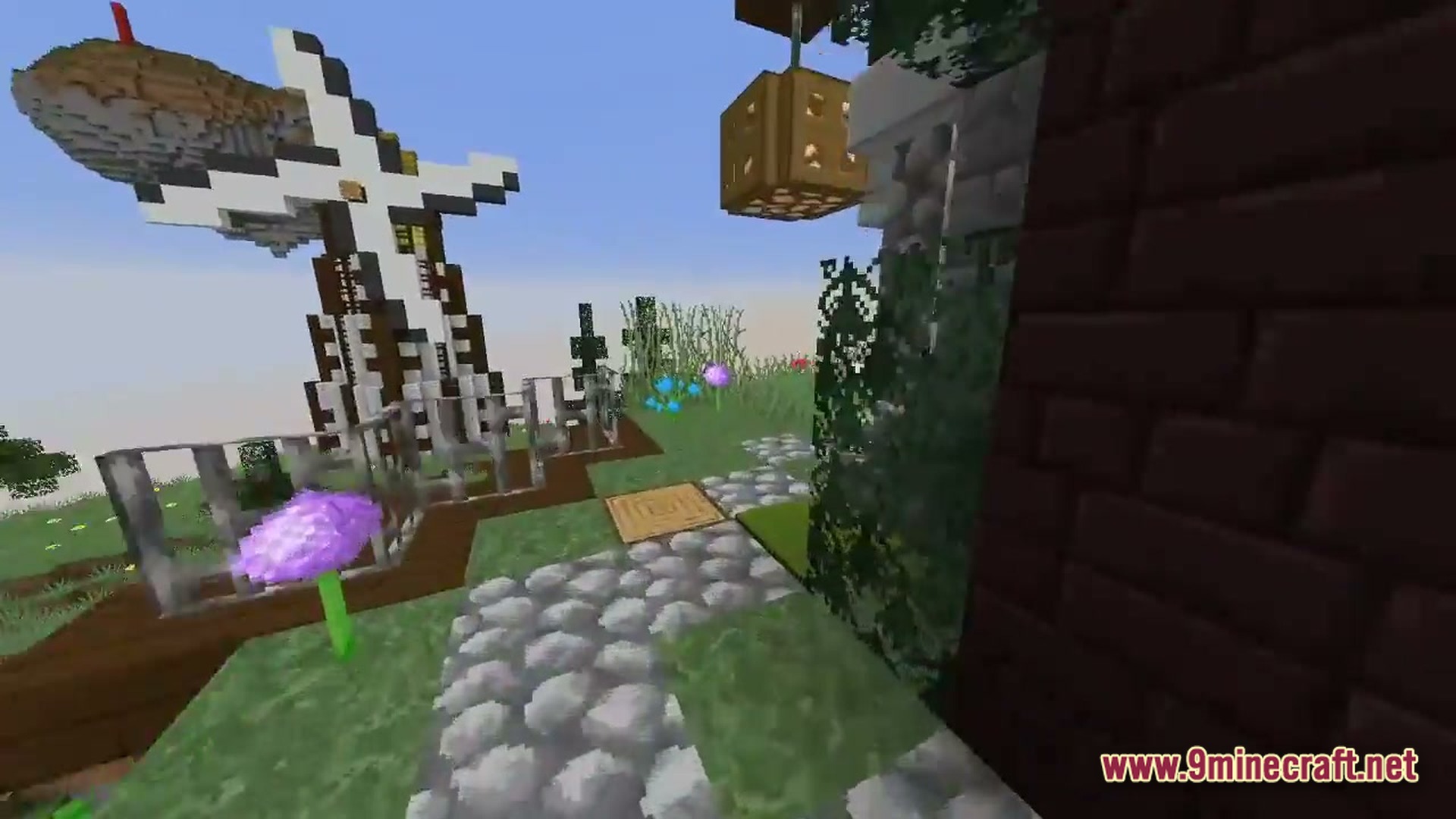 Arcane Industrial Synthesis Modpack Screenshot 4 A cobblestone path leads past a windmill and floating island in a grassy skyblock environment