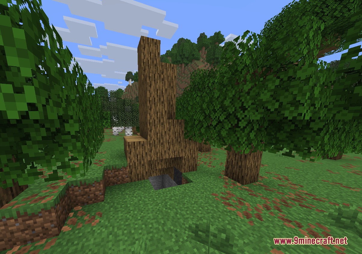 A tall oak log tower with a small entrance in a forest