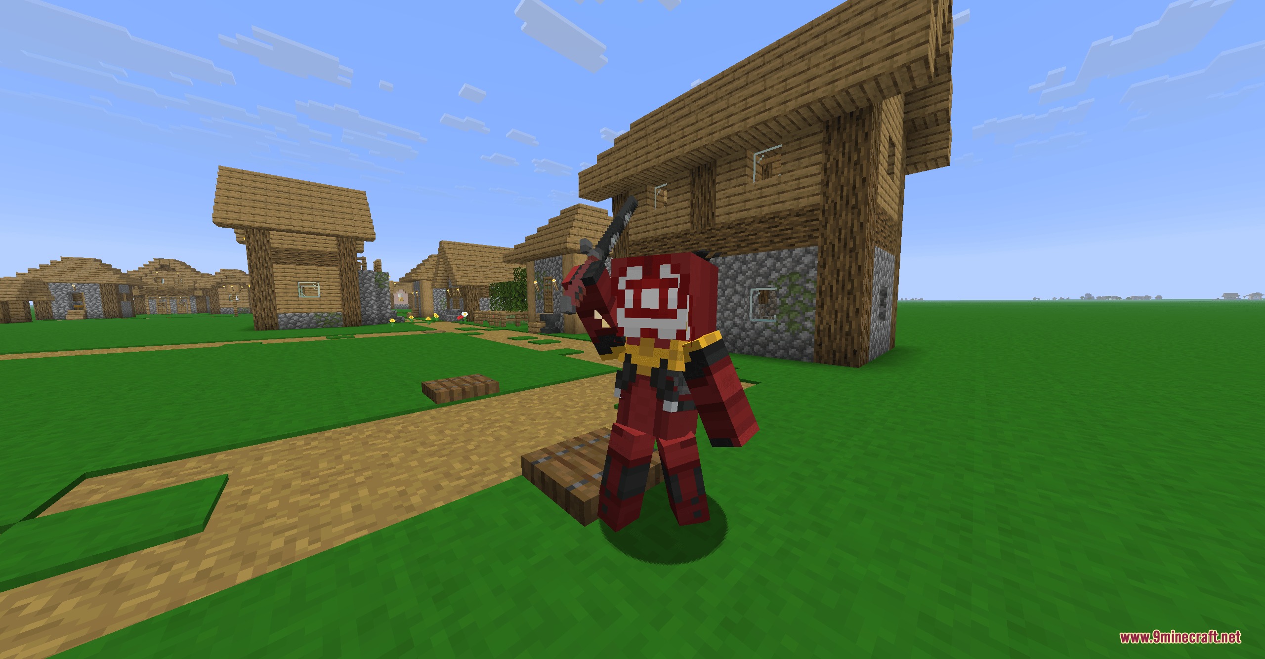 Armory of the Wild Resource Pack Screenshot 1 A player wearing a Yiga Blademaster skin holds a sword in a village