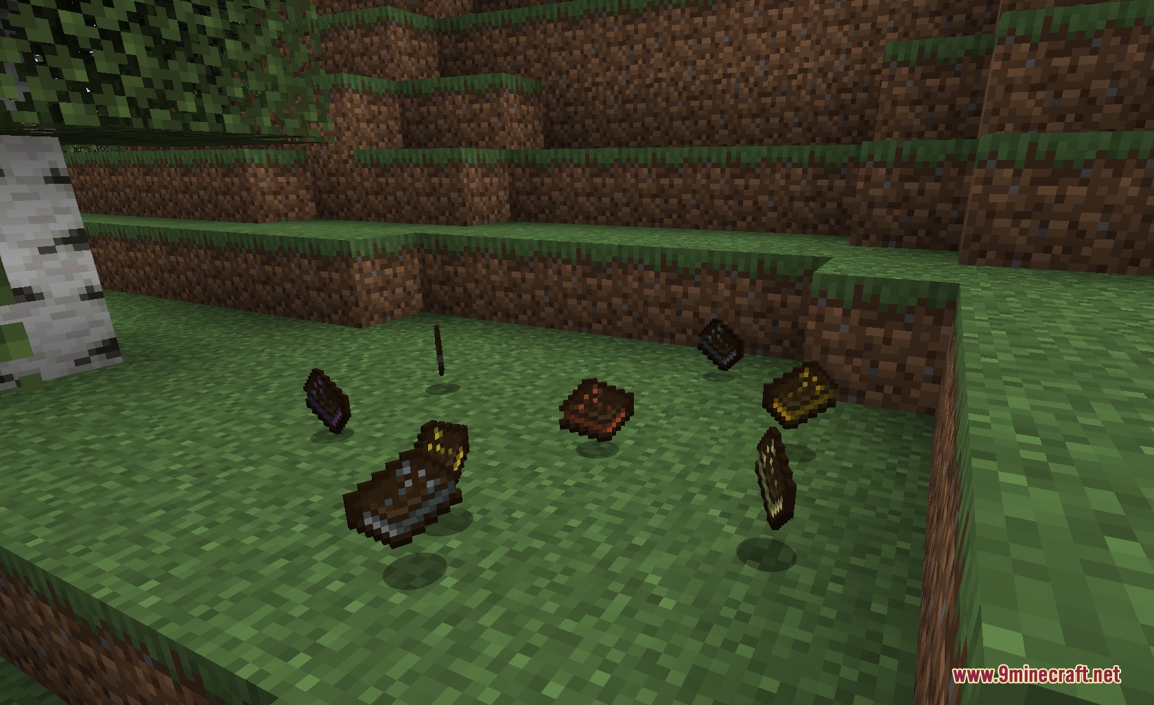 Ascendant Smithing Metals Mod Screenshot 5 Forbidden Tomes scattered on the grass in a Minecraft forest biome