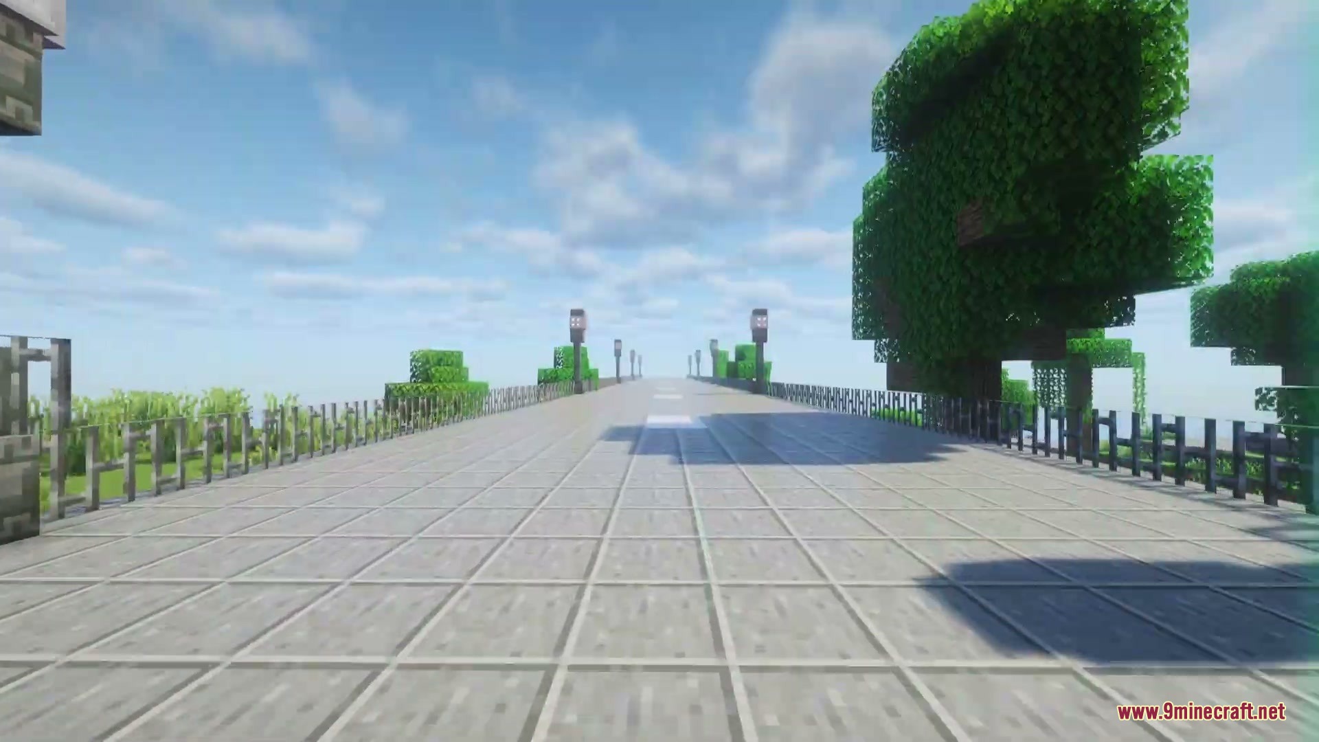 Asphalt Horizon Mod Screenshot 1 A wide asphalt road with streetlights and fences stretching into the distance