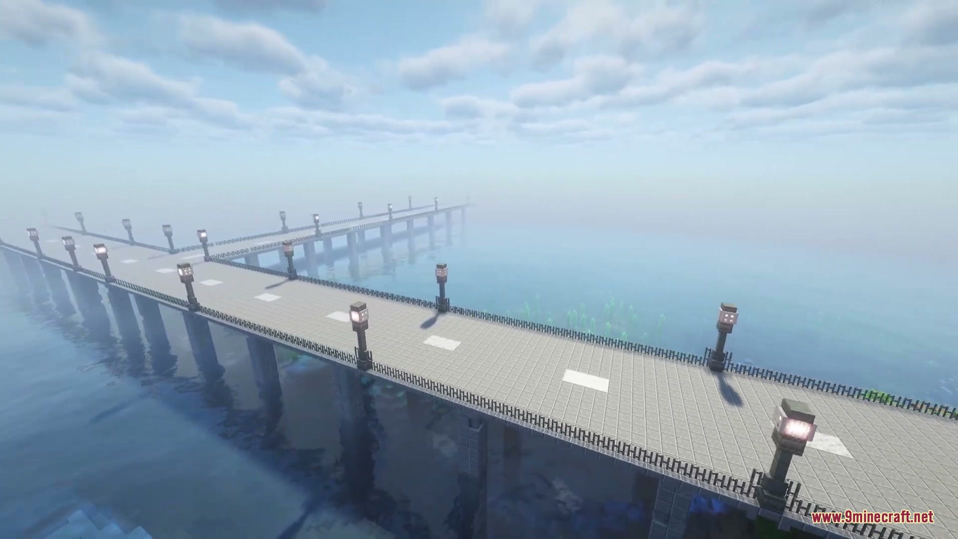 Asphalt Horizon Mod Screenshot 3 A long bridge with lamp posts stretches across a foggy ocean in Minecraft