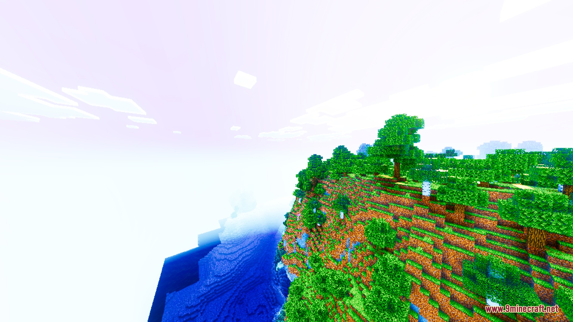 Auren Visuals Shader Screenshot 6 Lush green cliffside overlooking deep blue water with bright saturated lighting