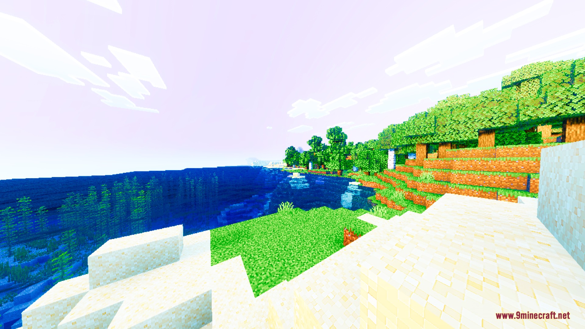 Auren Visuals Shader Screenshot 9 A bright Minecraft coastline with saturated green grass and clear blue ocean water