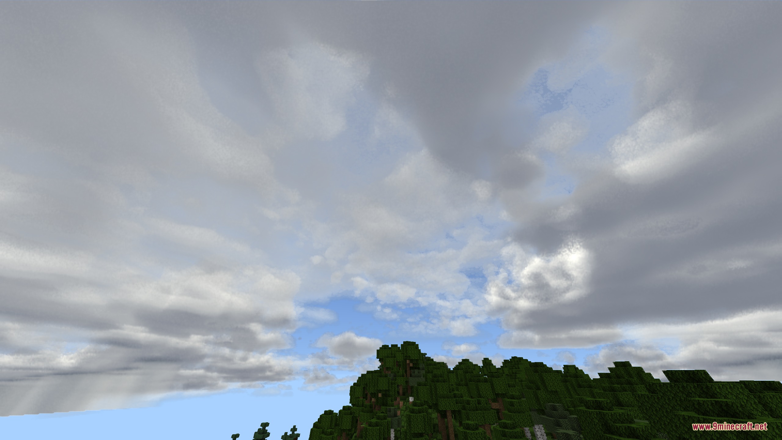 Autumn's Realistic Clouds Resource Pack Screenshot 1 Realistic wispy clouds fill the sky above a green forest in Minecraft