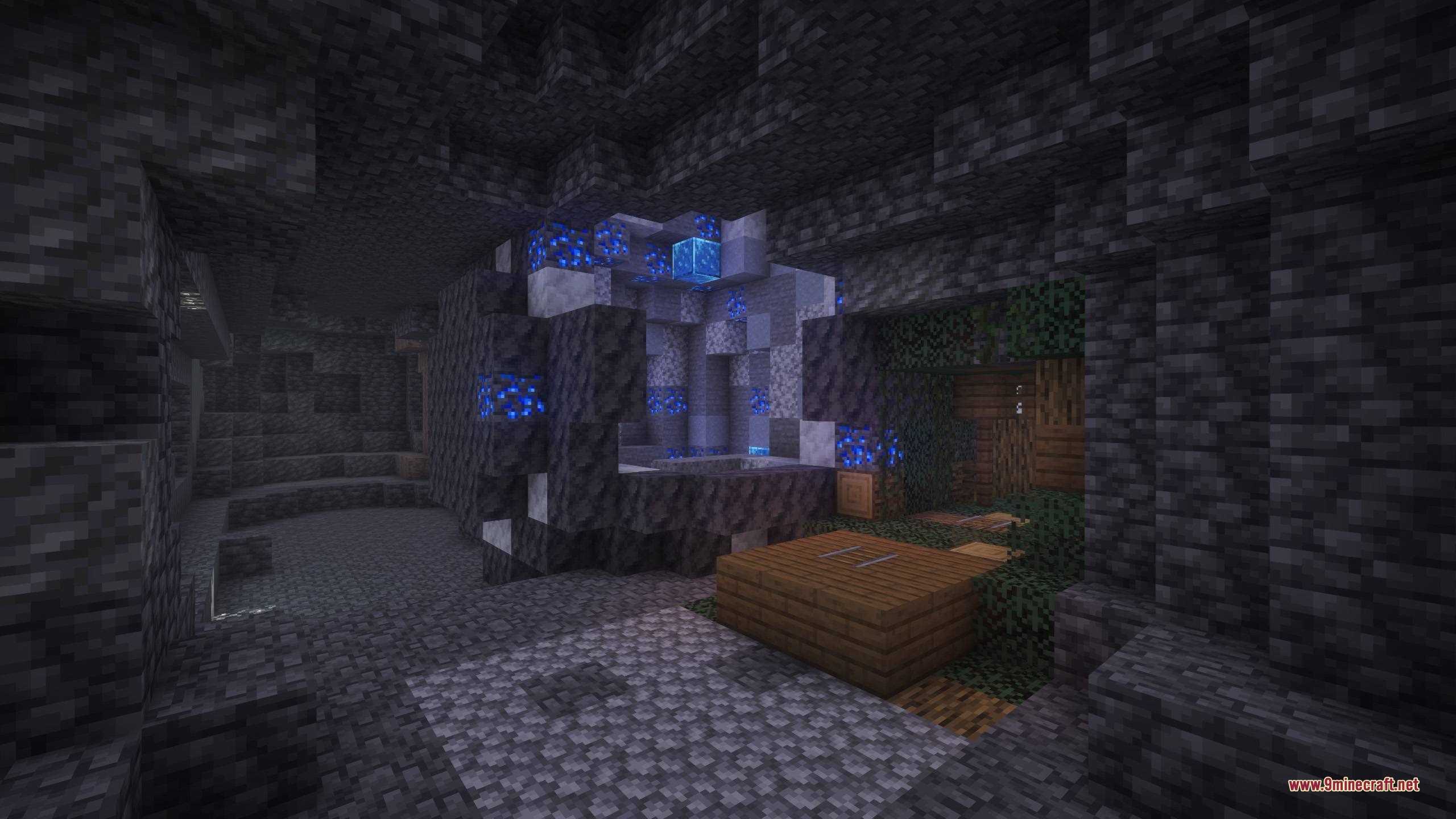 BM More Geodes Data Pack Screenshot 1 A glowing blue ore geode discovered inside a dark deepslate cave system