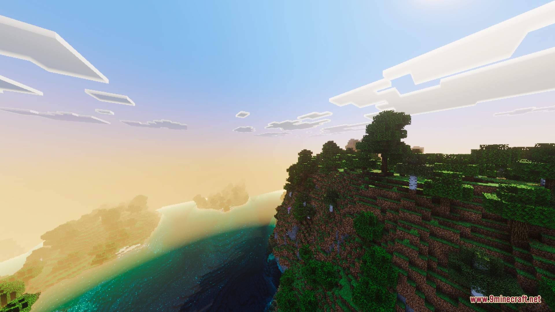 Vibrant landscape view of clear water and cliffs under a glowing sky