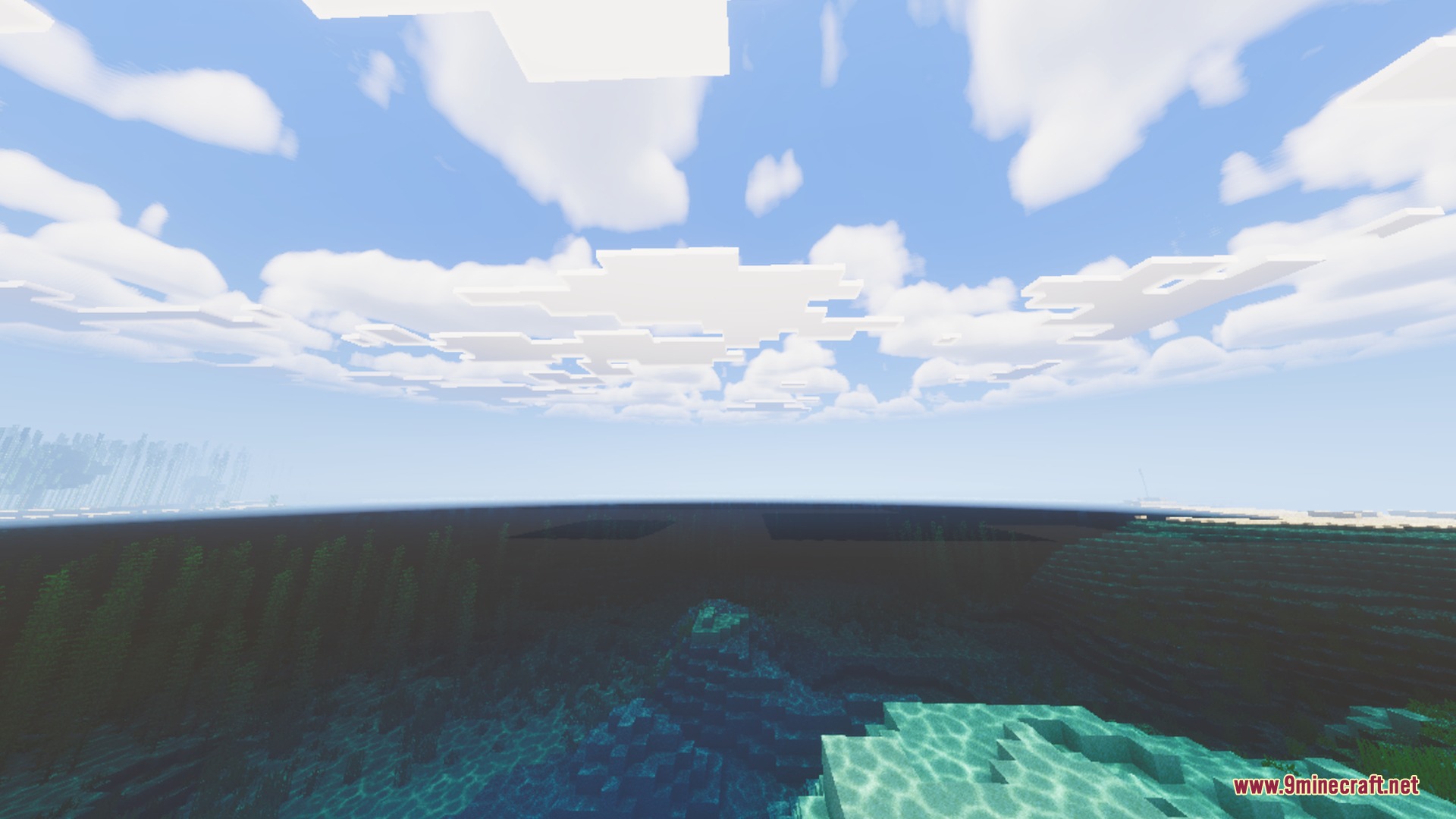 Clear ocean water with realistic surface caustics under a bright blue sky