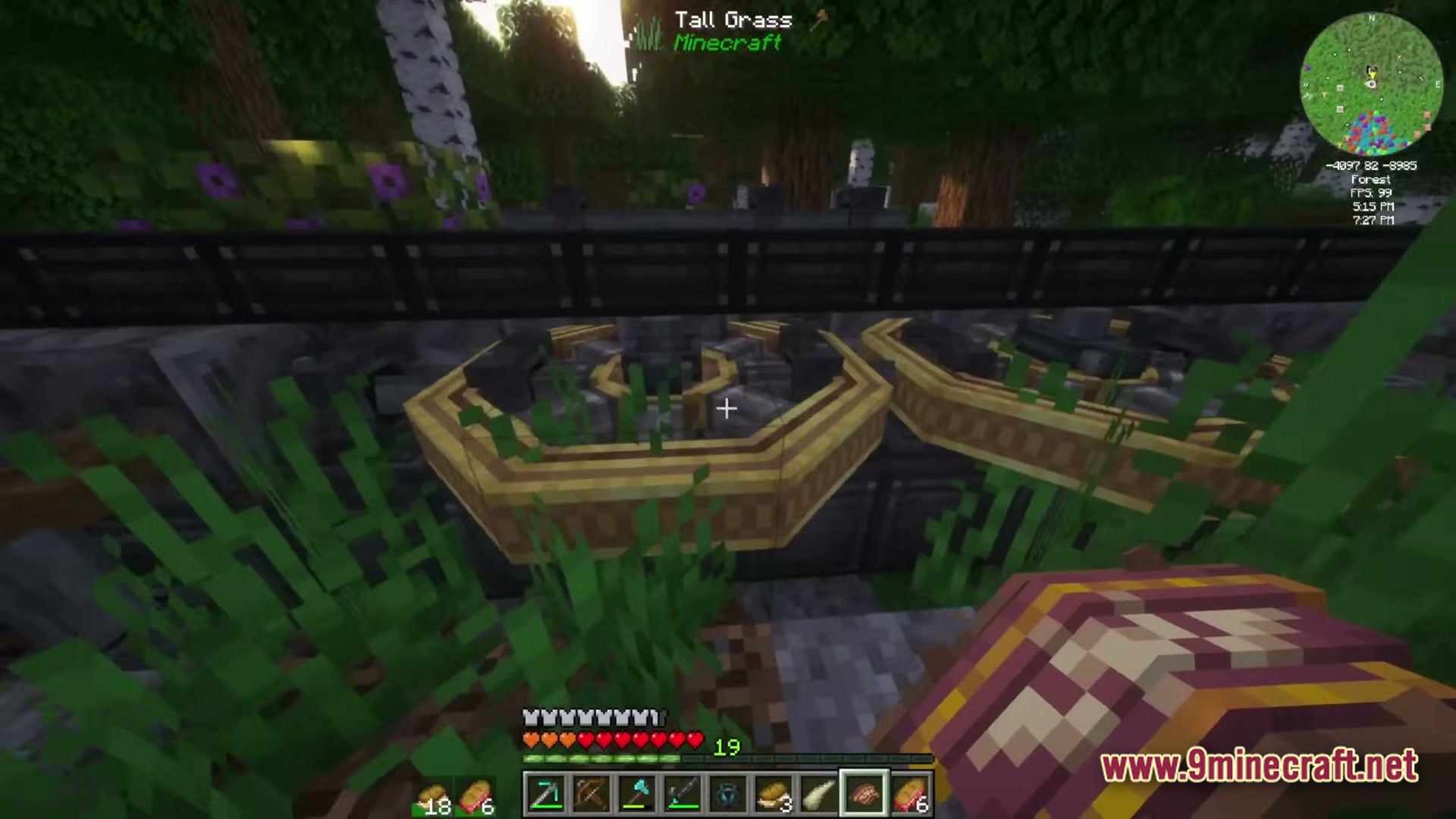 Large mechanical brass gears and machinery components are situated within a forest biome