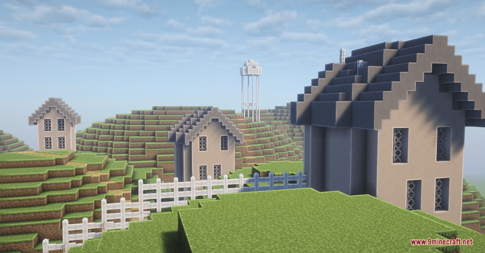 Backrooms Retextured Resource Pack Screenshot 7 Minecraft houses and a water tower standing on a grassy hillside landscape
