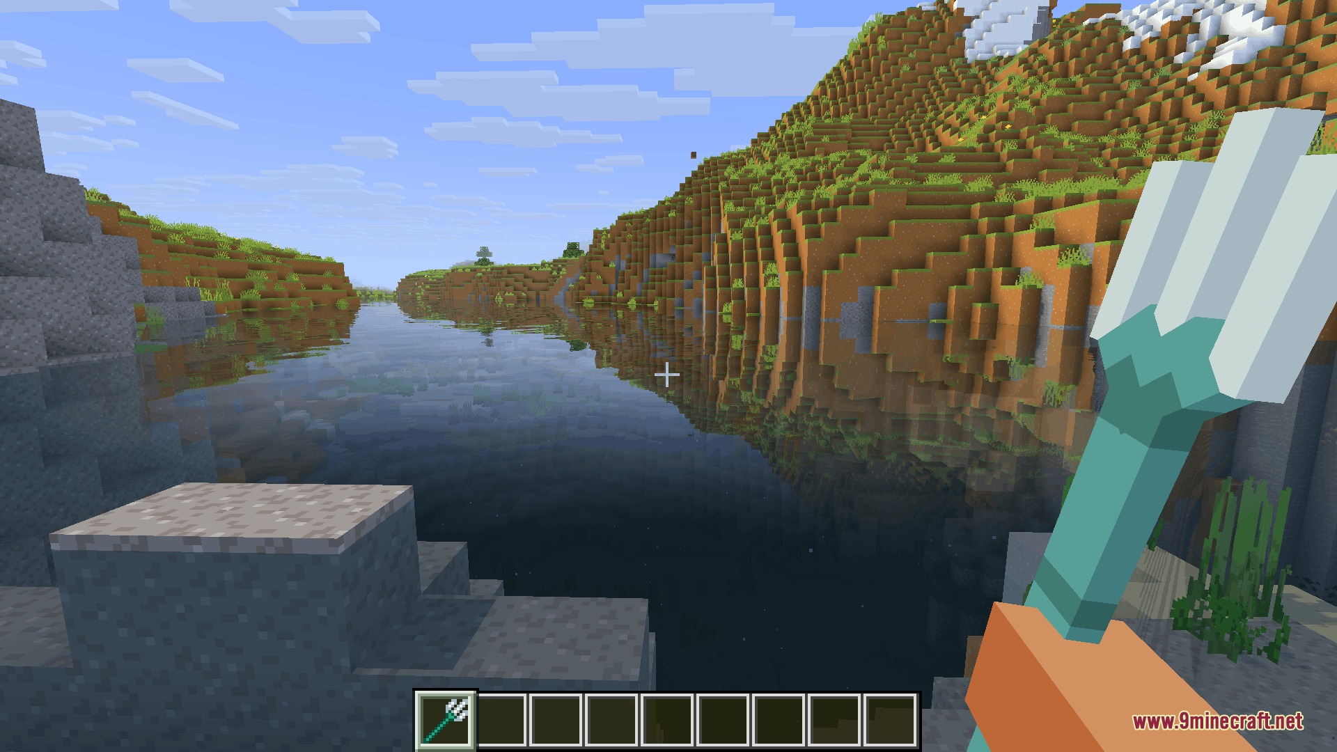 Player holding a white three dimensional trident near a calm river landscape