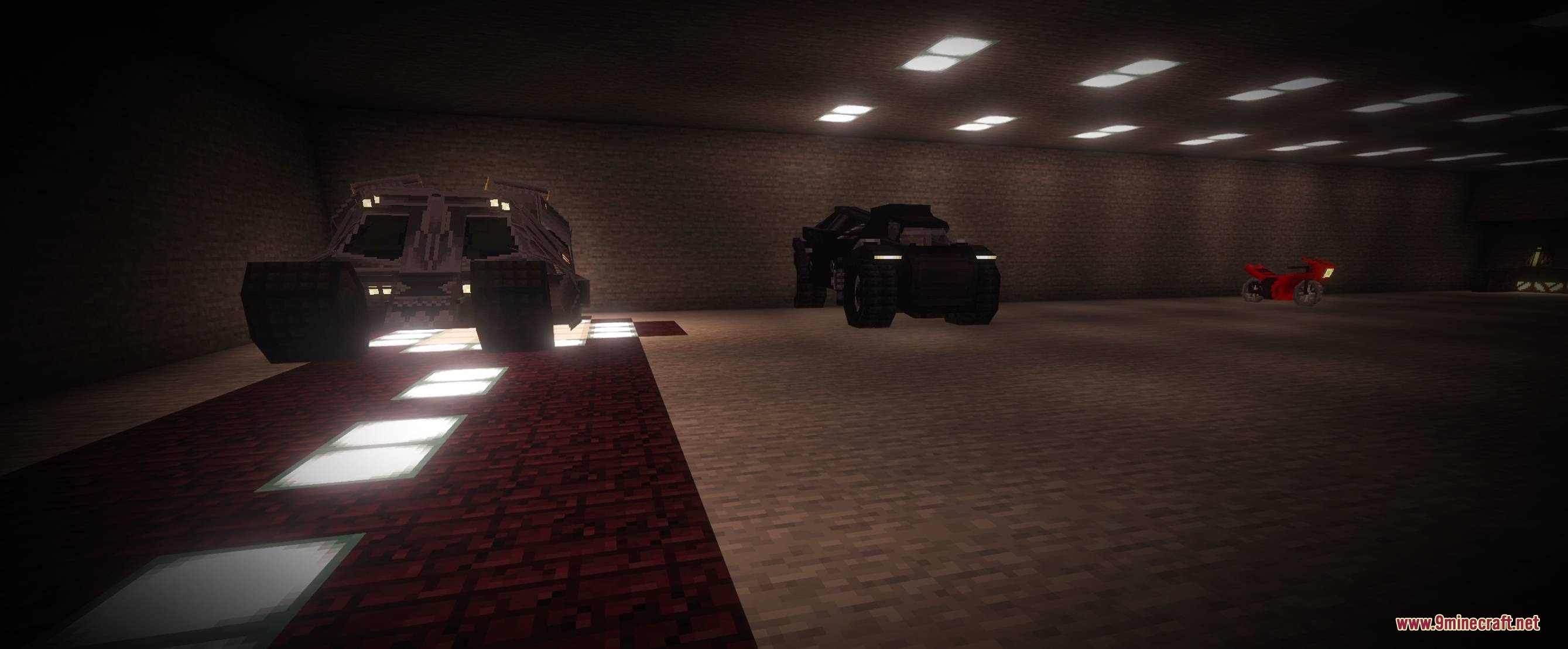 Batman by Yo Fadda Mod Screenshot 7 Several custom vehicles parked inside a large underground base with floor lighting