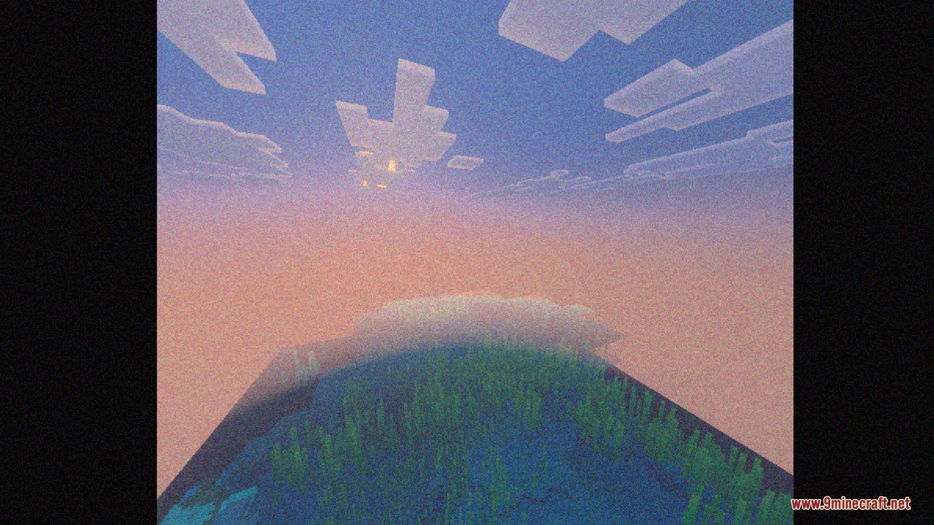 Sunset over a Minecraft ocean with a heavy retro video grain effect