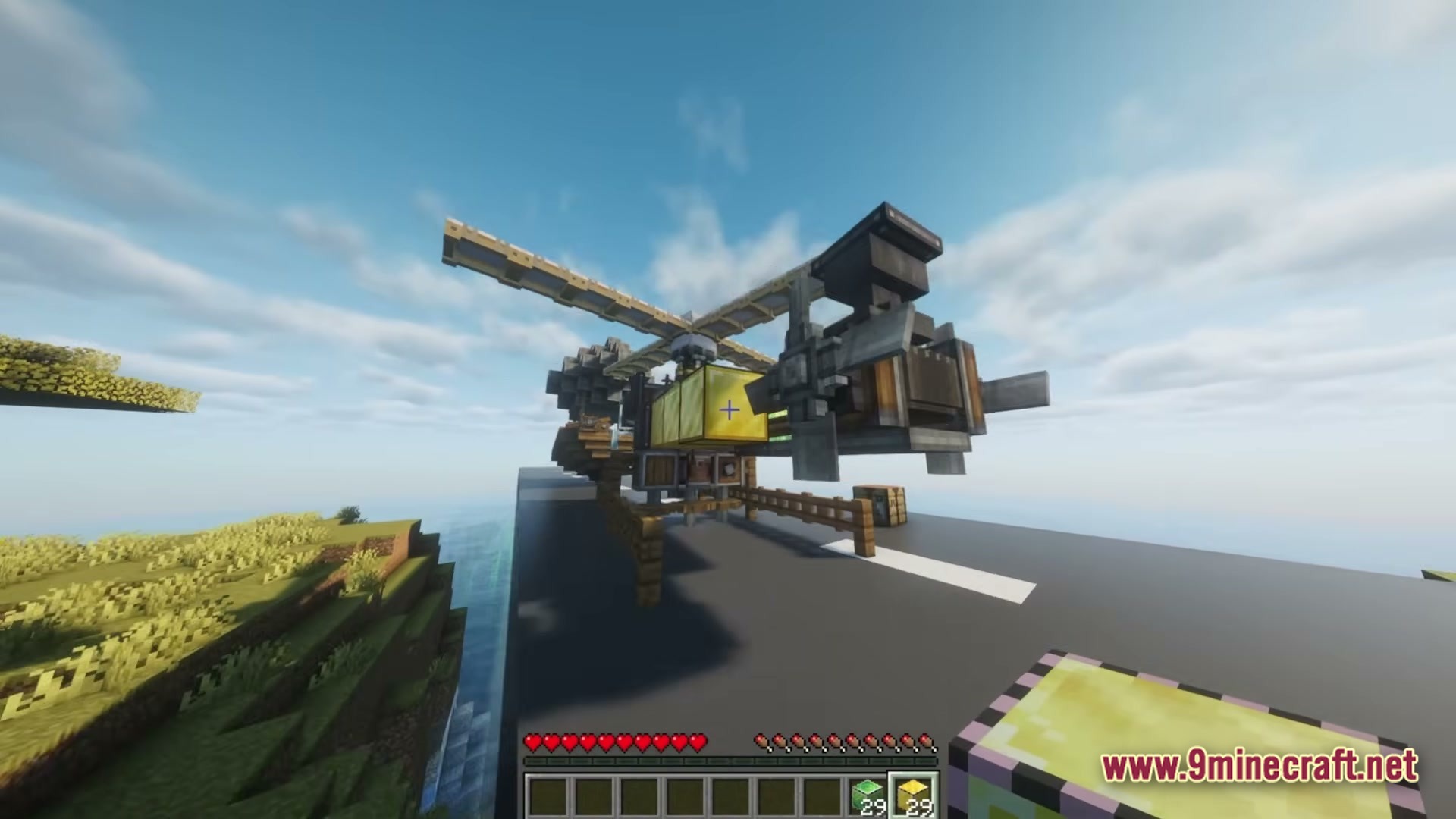 A custom-built helicopter machine constructed with Create mod components sits on a paved runway