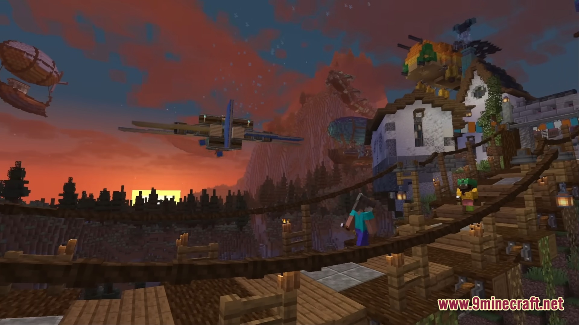 A player stands on a wooden bridge overlooking aircraft and buildings during a sunset