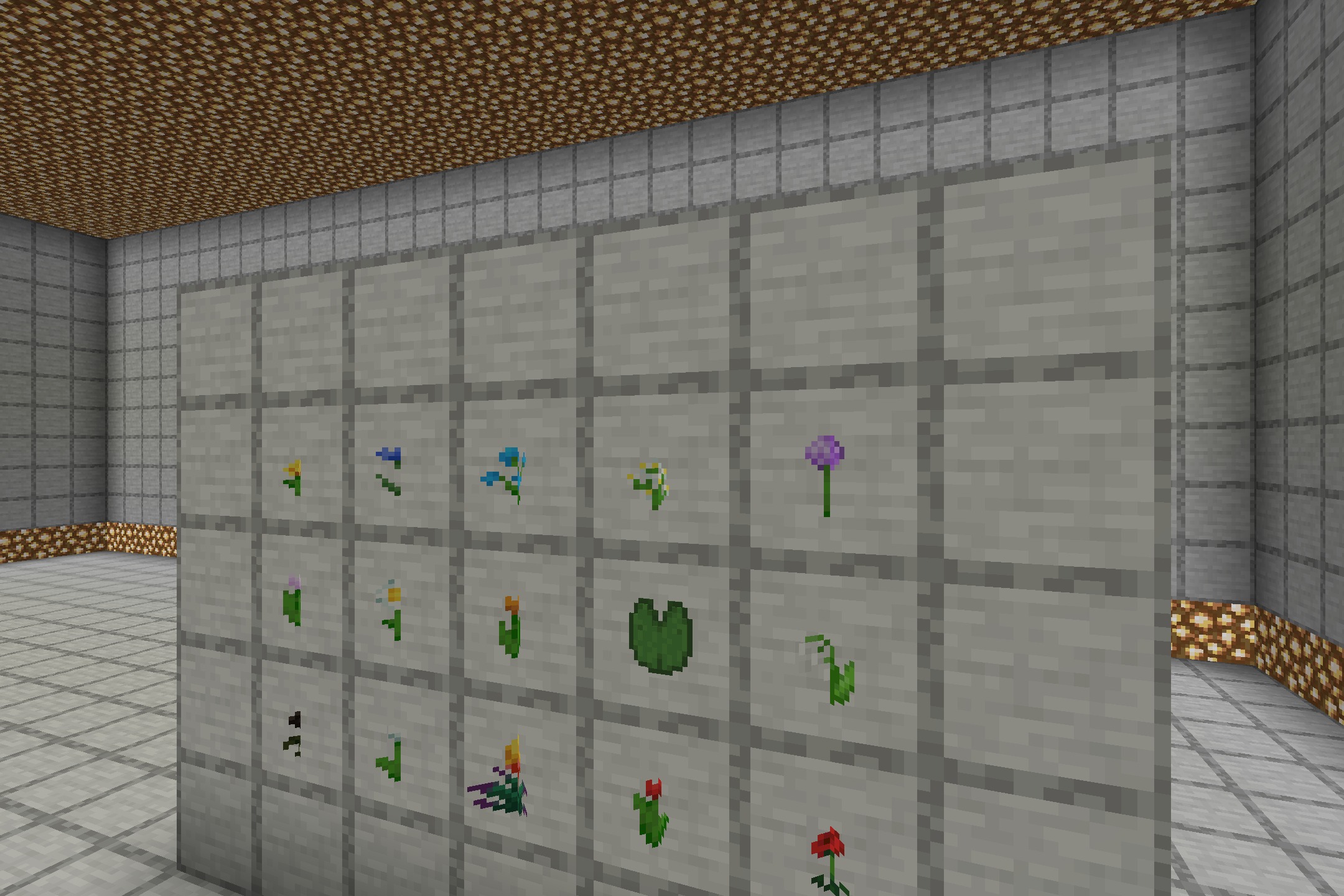 Various 3D flower models and lily pads displayed in item frames on stone