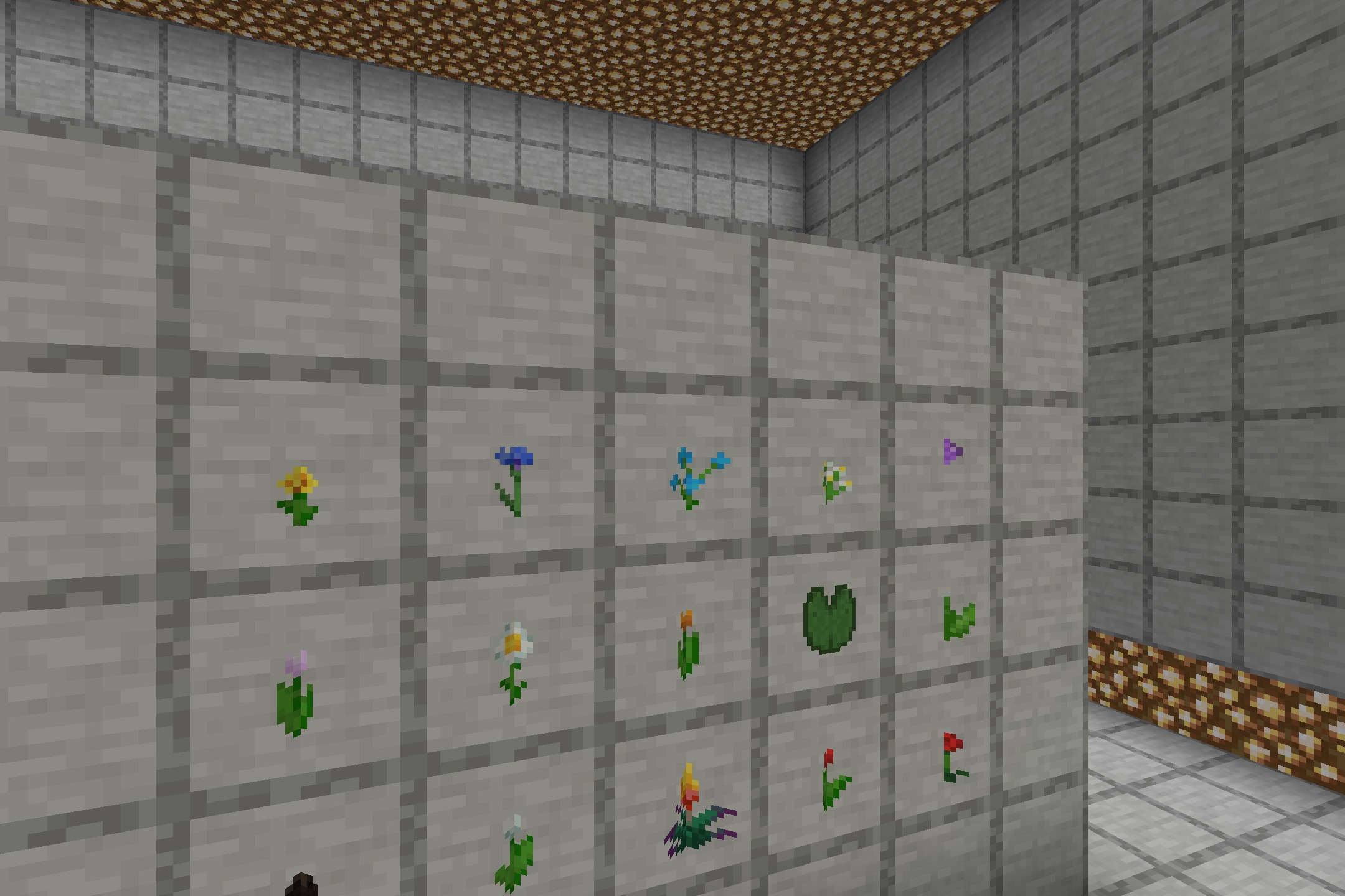 Close up of 3D flowers and lily pads shown in item frames on wall