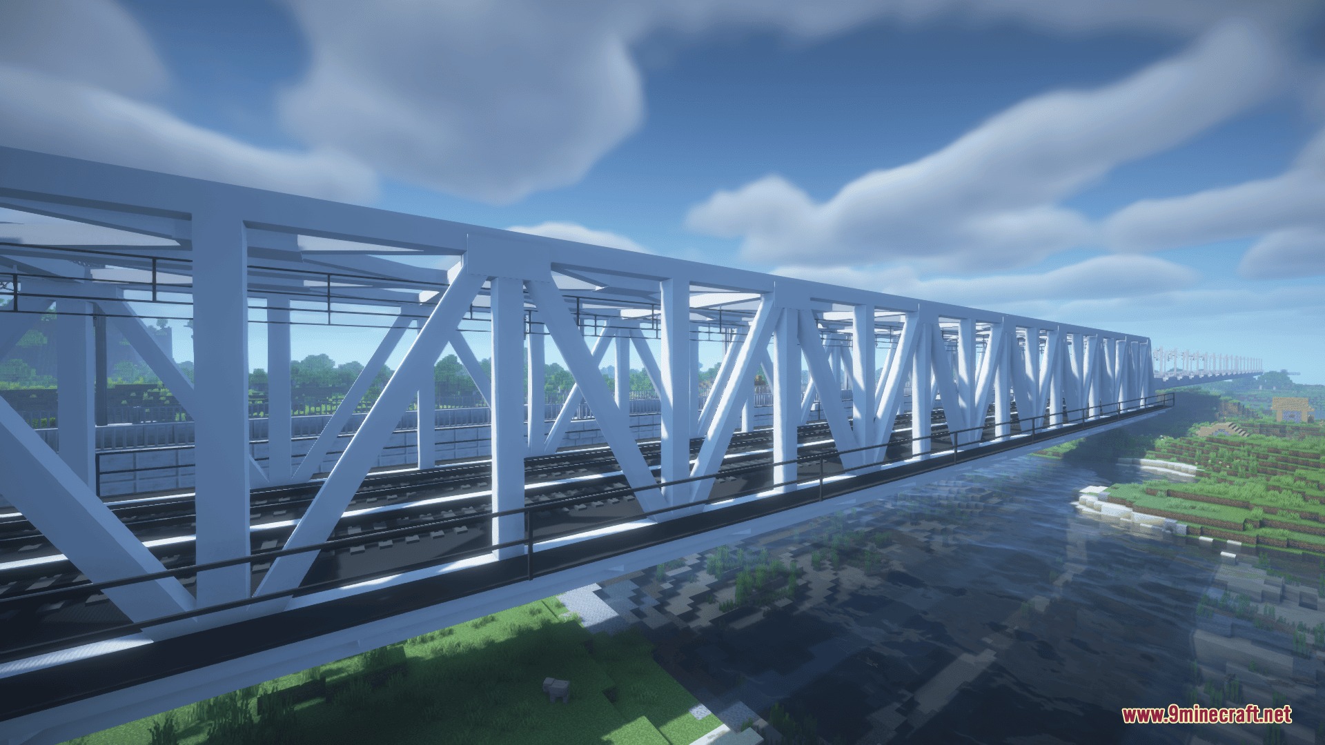 Bharat Rail Transit Resource Pack Screenshot 5 A long white metal railway bridge spanning across a river in Minecraft