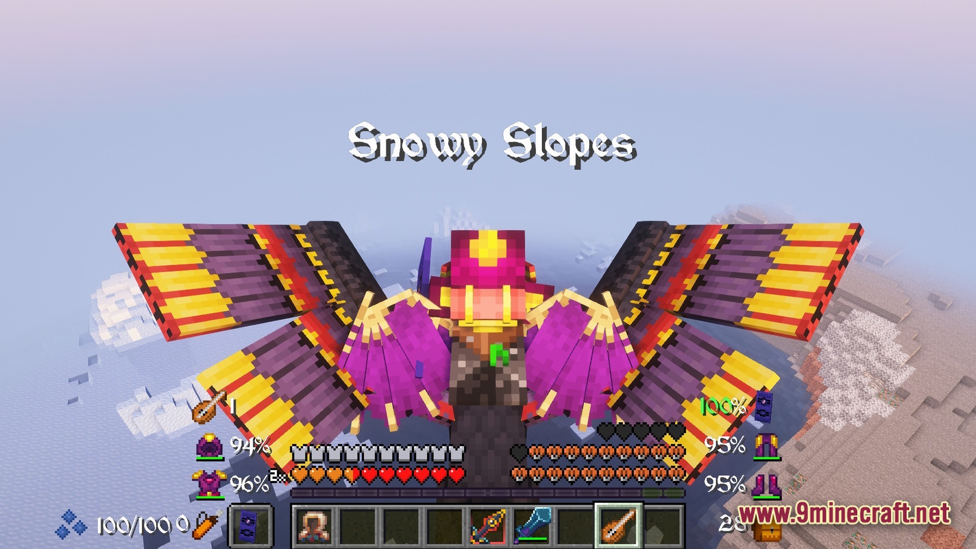 Biomes And Dungeons BAD RPG & Magic Modpack Screenshot 10 A player wearing colorful mechanical wings flies over a Snowy Slopes biome with a custom RPG HUD