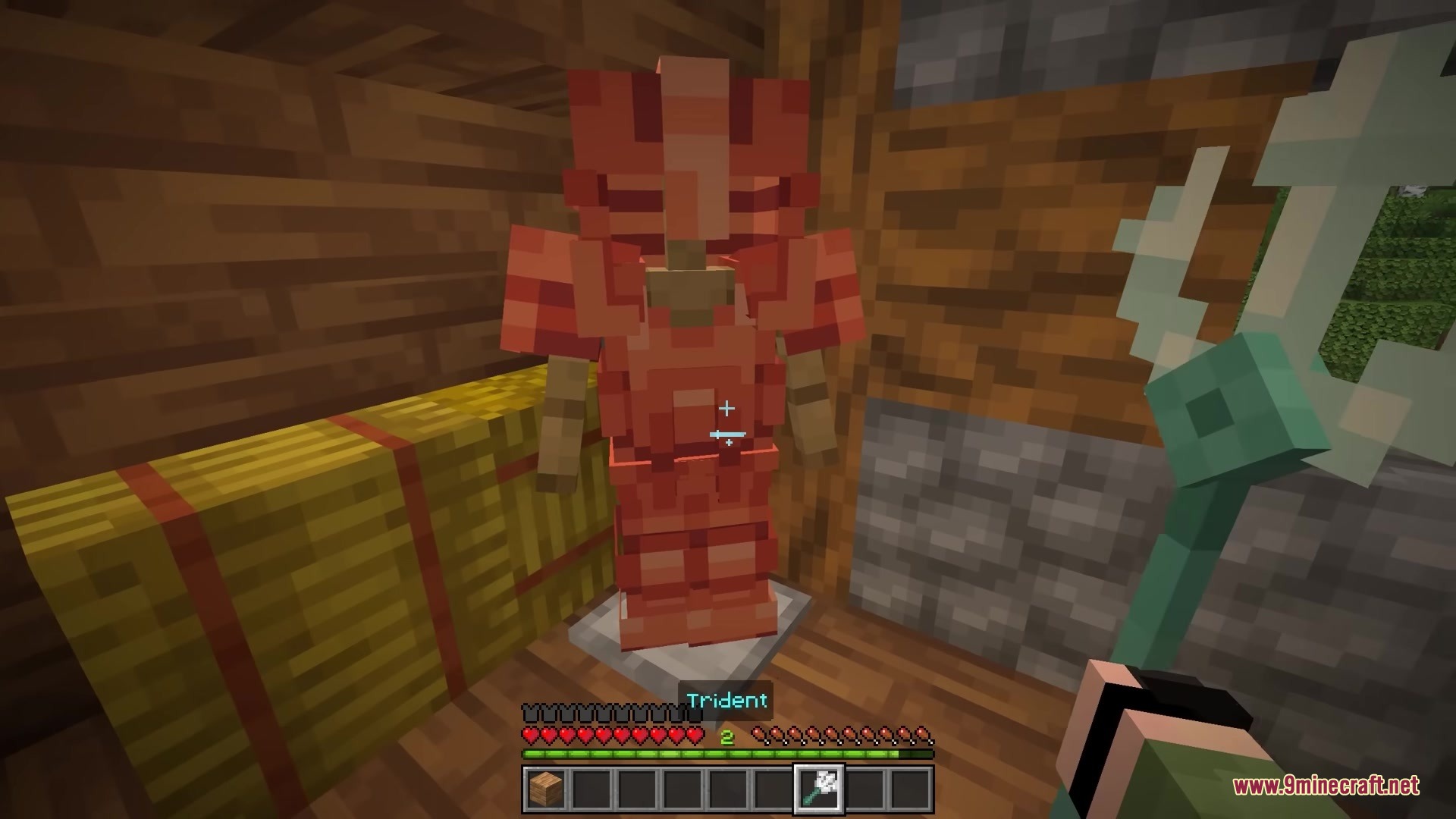 Bits and Balance Mod Screenshot 11 Minecraft player holding a trident next to red armor on an armor stand