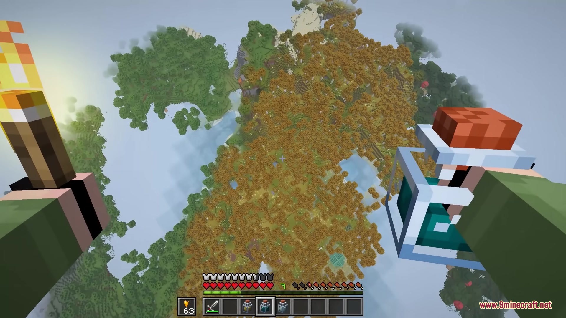 Bits and Balance Mod Screenshot 6 Aerial view of a player flying over a dense autumn forest