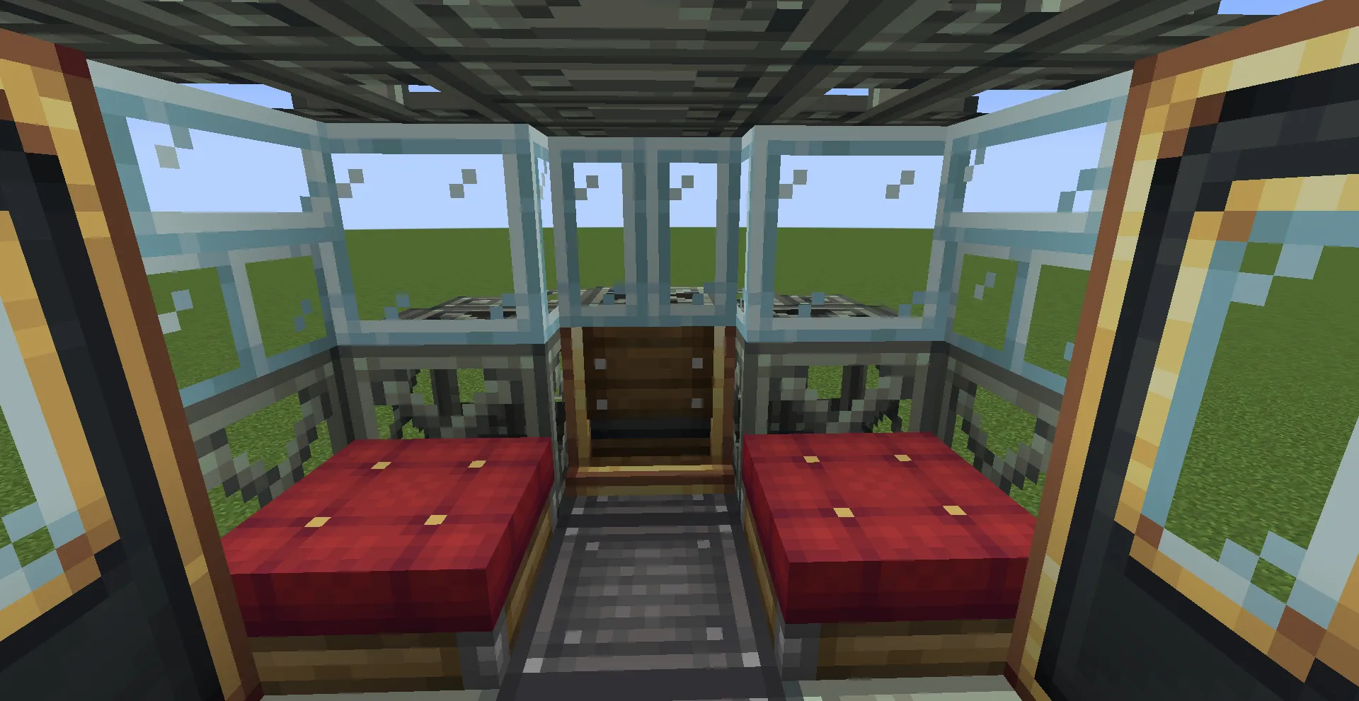 Interior view of a train cabin with red seats and glass windows