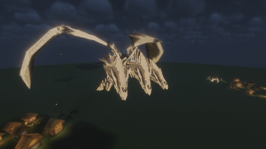 The glowing three headed dragon looms over a small village at night