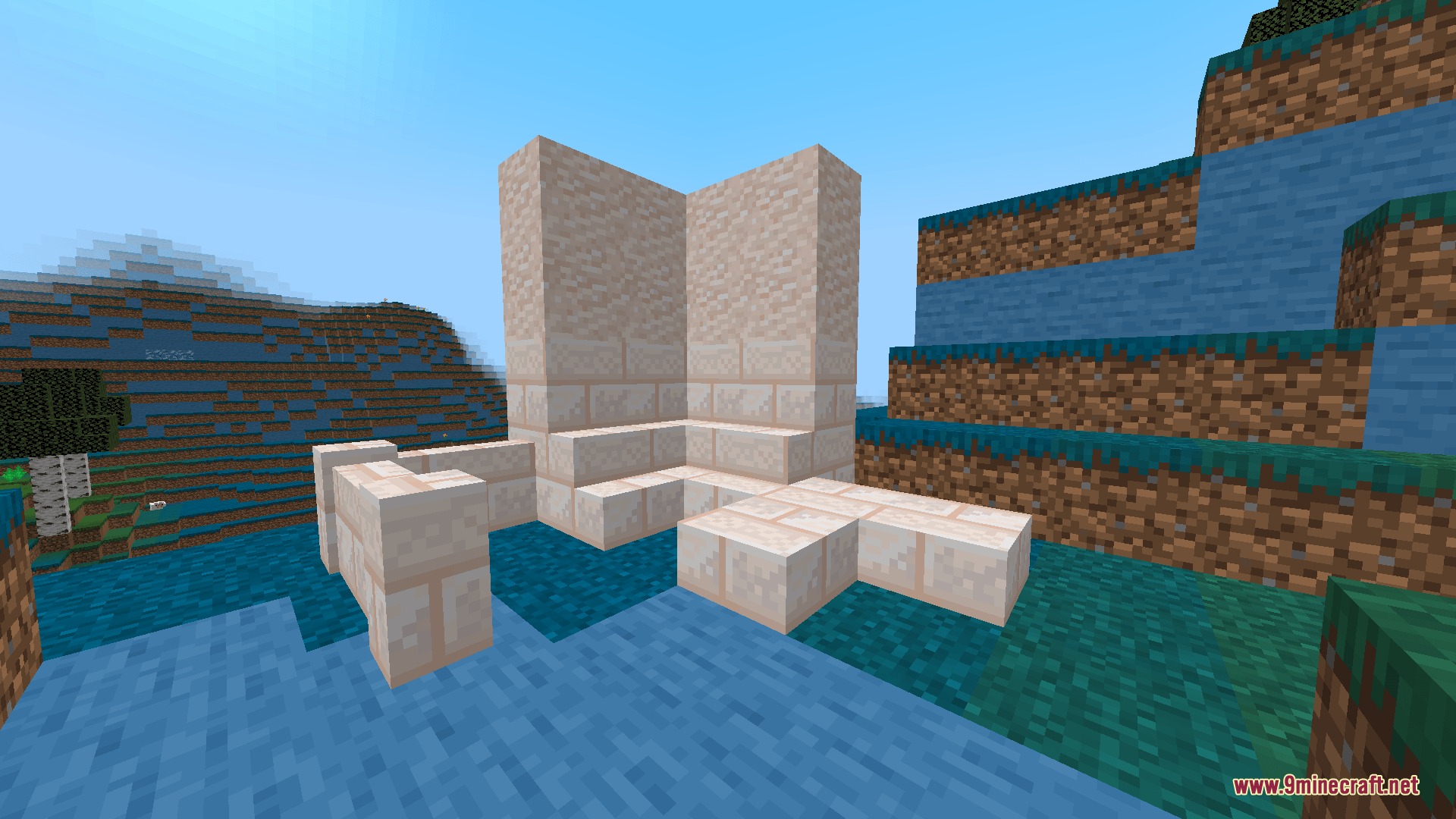A corner structure built with light colored decorative blocks in a Minecraft world