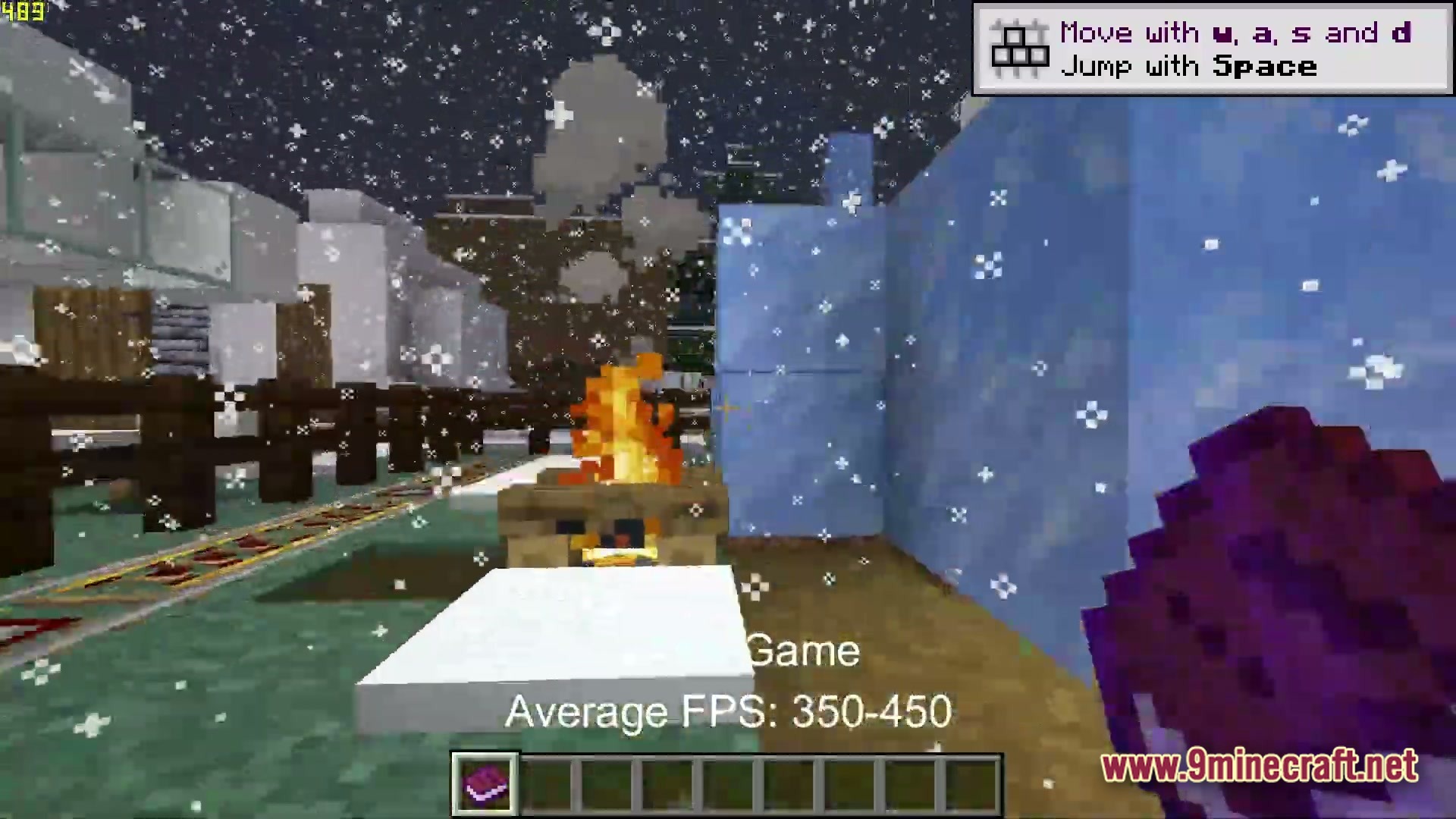 Boosted FPS Performance Optimized Modpack Screenshot 3 A player holds an enchanted book while standing near a campfire during a snowy night