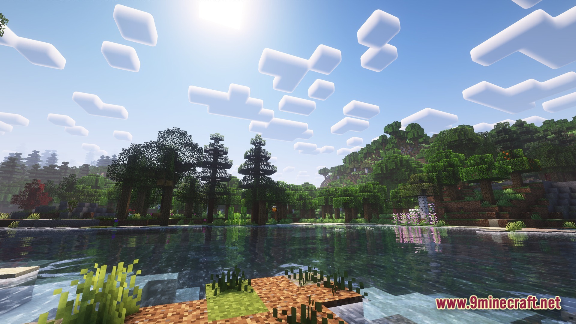 Boundless Tale Odyssey Modpack Screenshot 10 A serene lake surrounded by lush green forests and hills under a bright, sunny sky