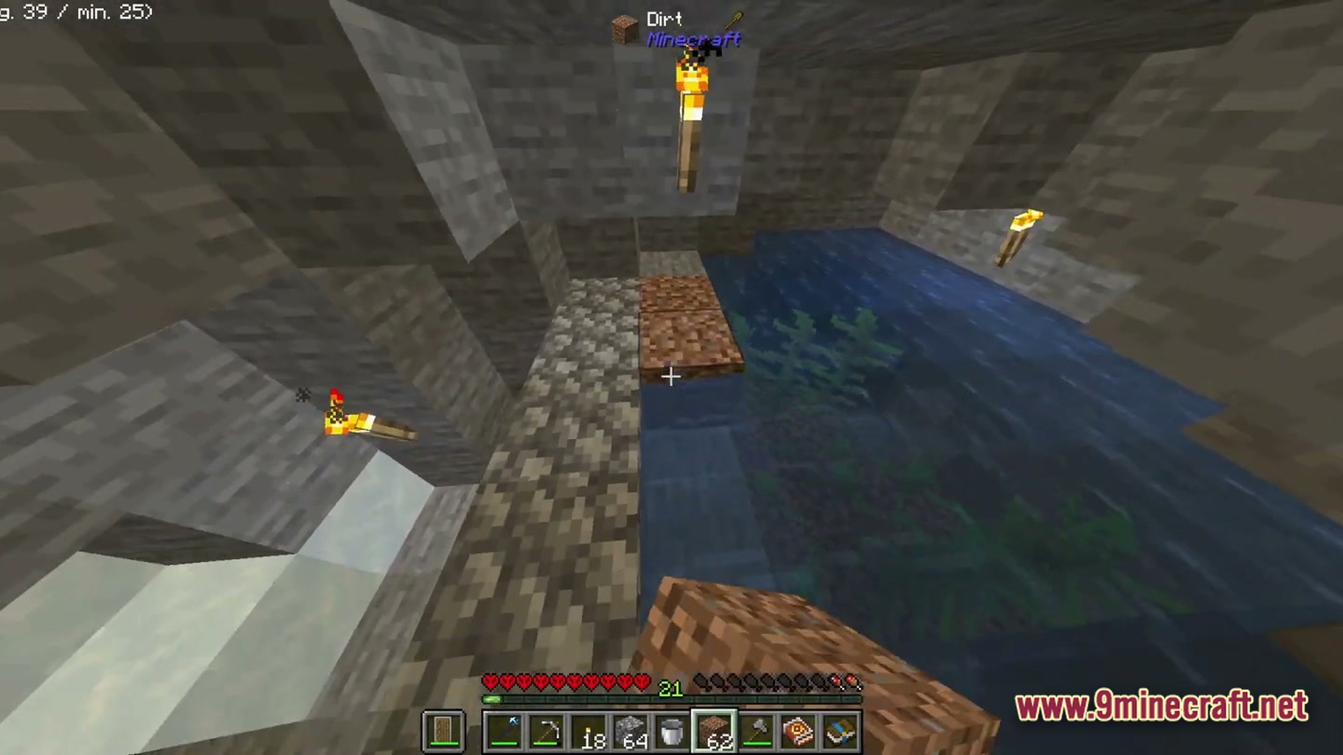 Boundless Tale Odyssey Modpack Screenshot 6 A player places dirt blocks near an underground pool of water inside a stone cave