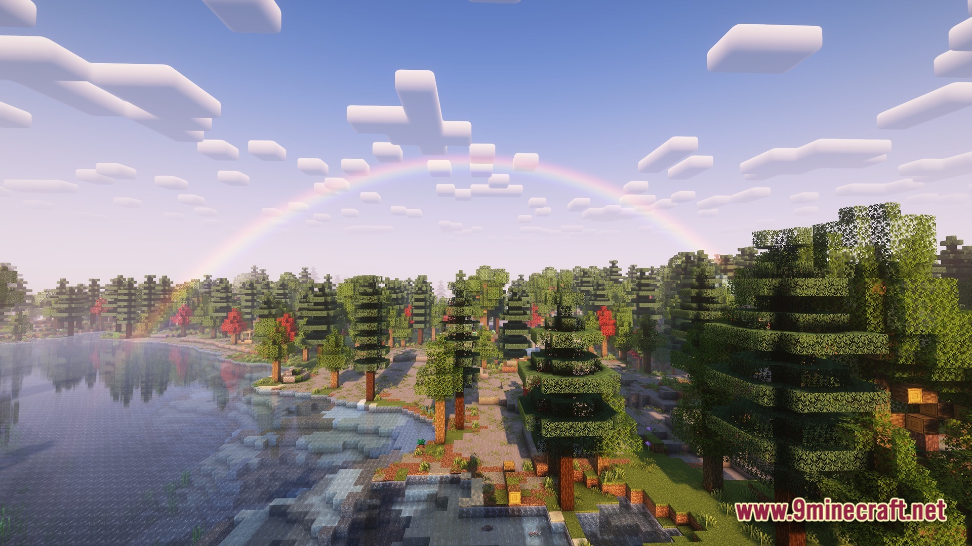 Boundless Tale Odyssey Modpack Screenshot 9 A rainbow arches over a coniferous forest biome and a lake with custom shaders enabled