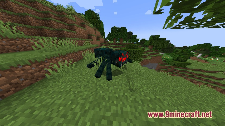 A large Cave Spider Boss with glowing red eyes stands on a grassy hill