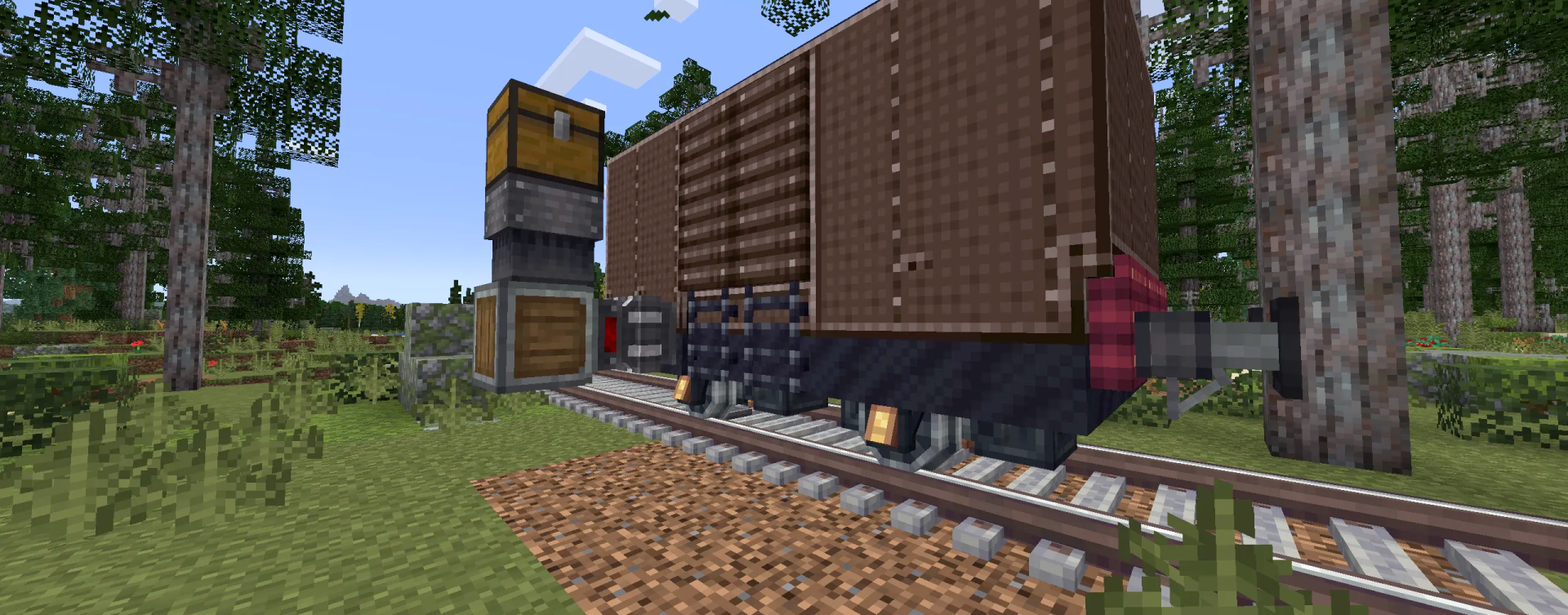 A brown boxwagon on a track with a chest and hopper loading mechanism