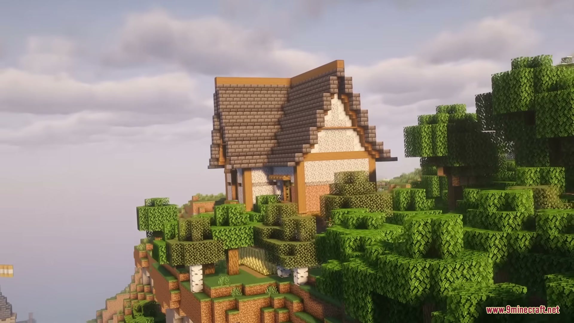 Brave Structures Mod Screenshot 7 A medieval house built on a cliff surrounded by a lush green forest