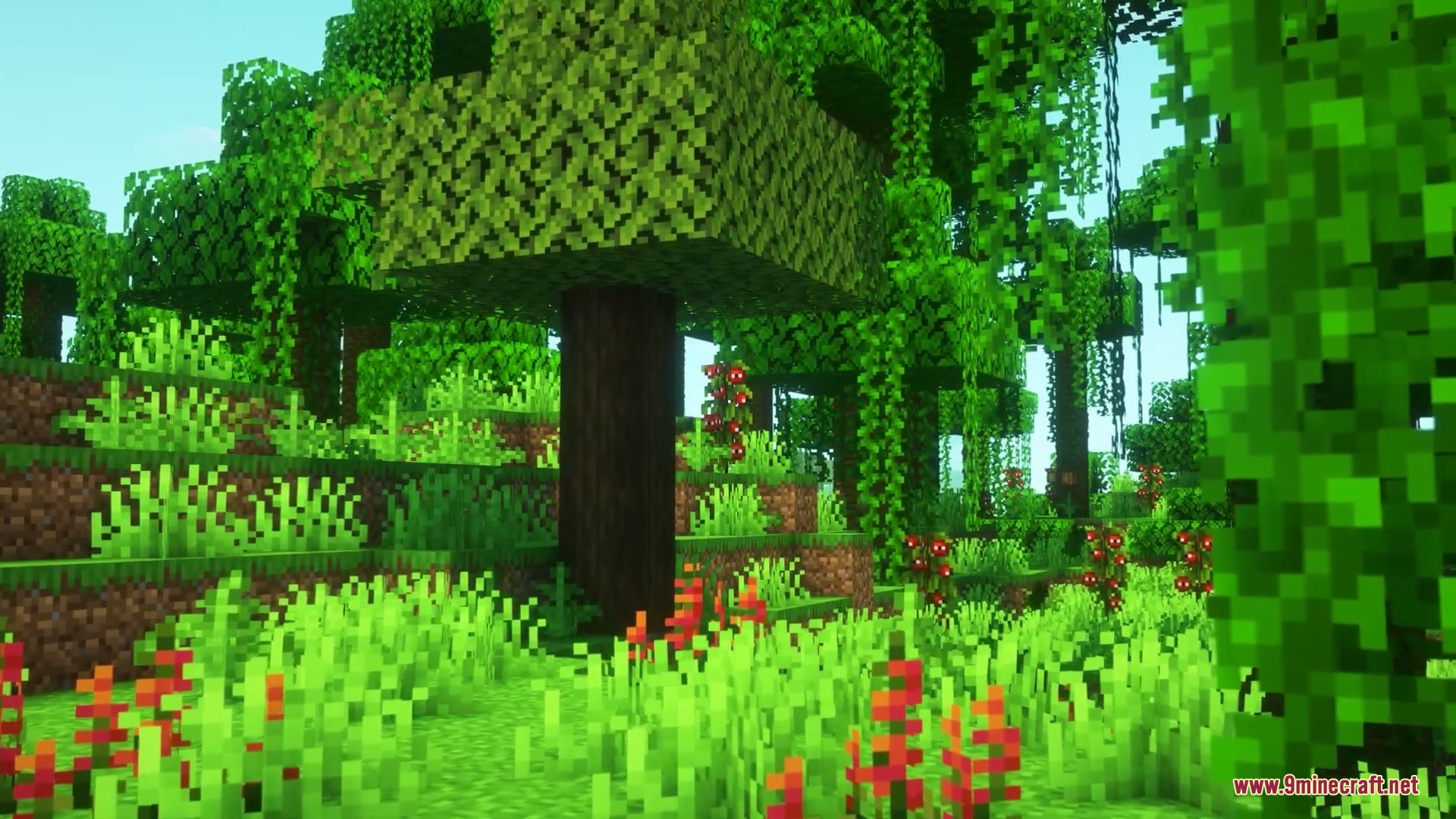 Brazilian Expansion Mod Screenshot 2 Vibrant red flowers and tall grass growing in a dense forest biome