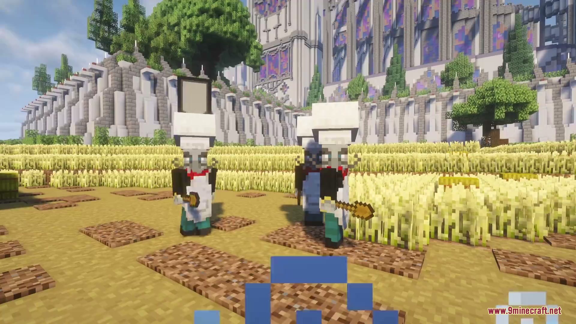 Chef illagers holding wooden spoons standing in a large golden wheat field
