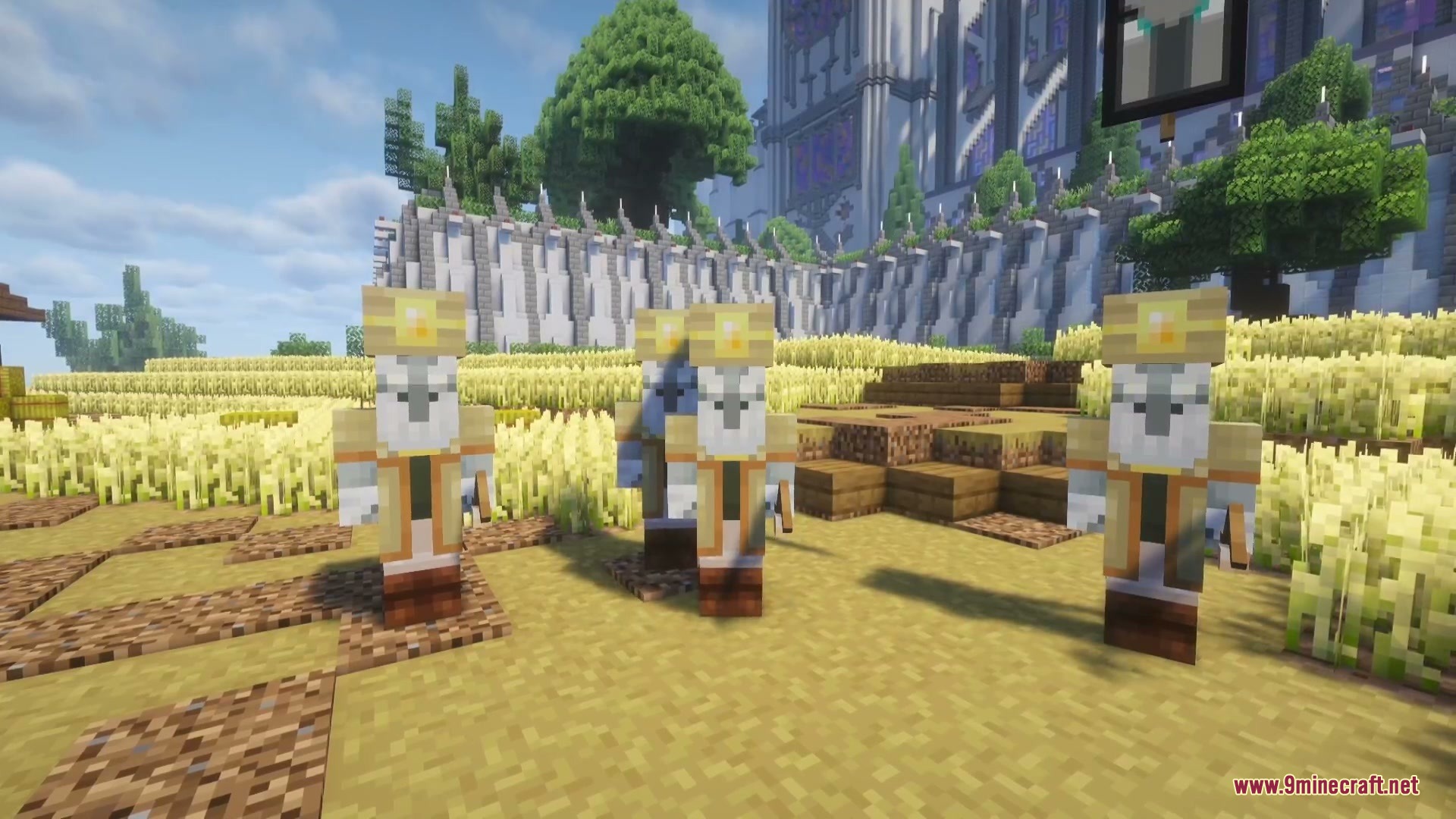 Three custom illagers with yellow hats stand in a large wheat field