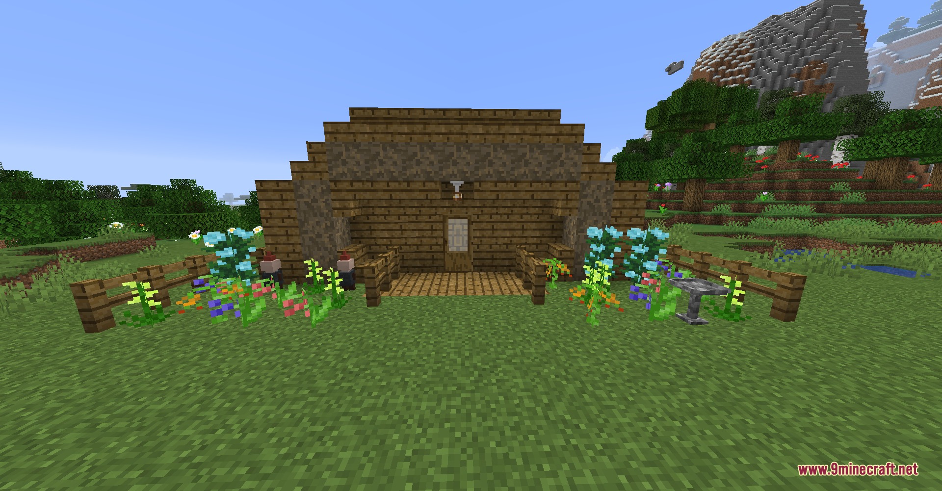 Bricks N' Blocks Mod Screenshot 3 A simple wooden house with a flower garden and a small porch