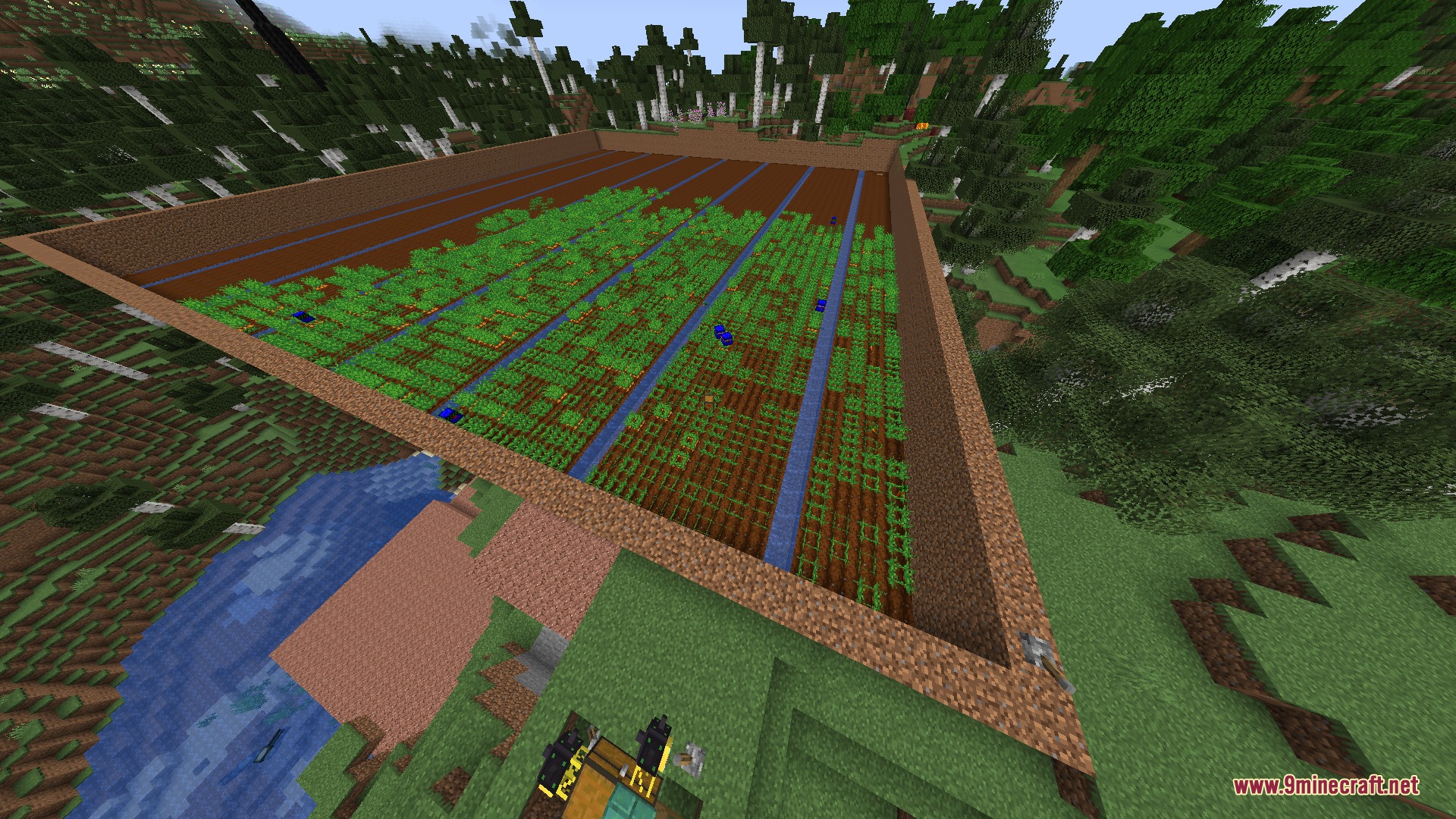 Build Craft Community Edition Mod Screenshot 2 A massive automated crop farm with water channels in a forest biome