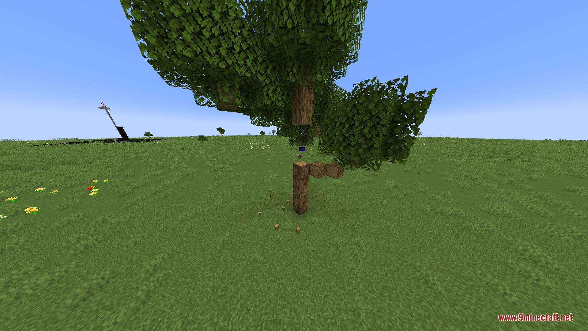 Build Craft Community Edition Mod Screenshot 7 A small blue robot from Build Craft Community Edition Mod chopping a tree