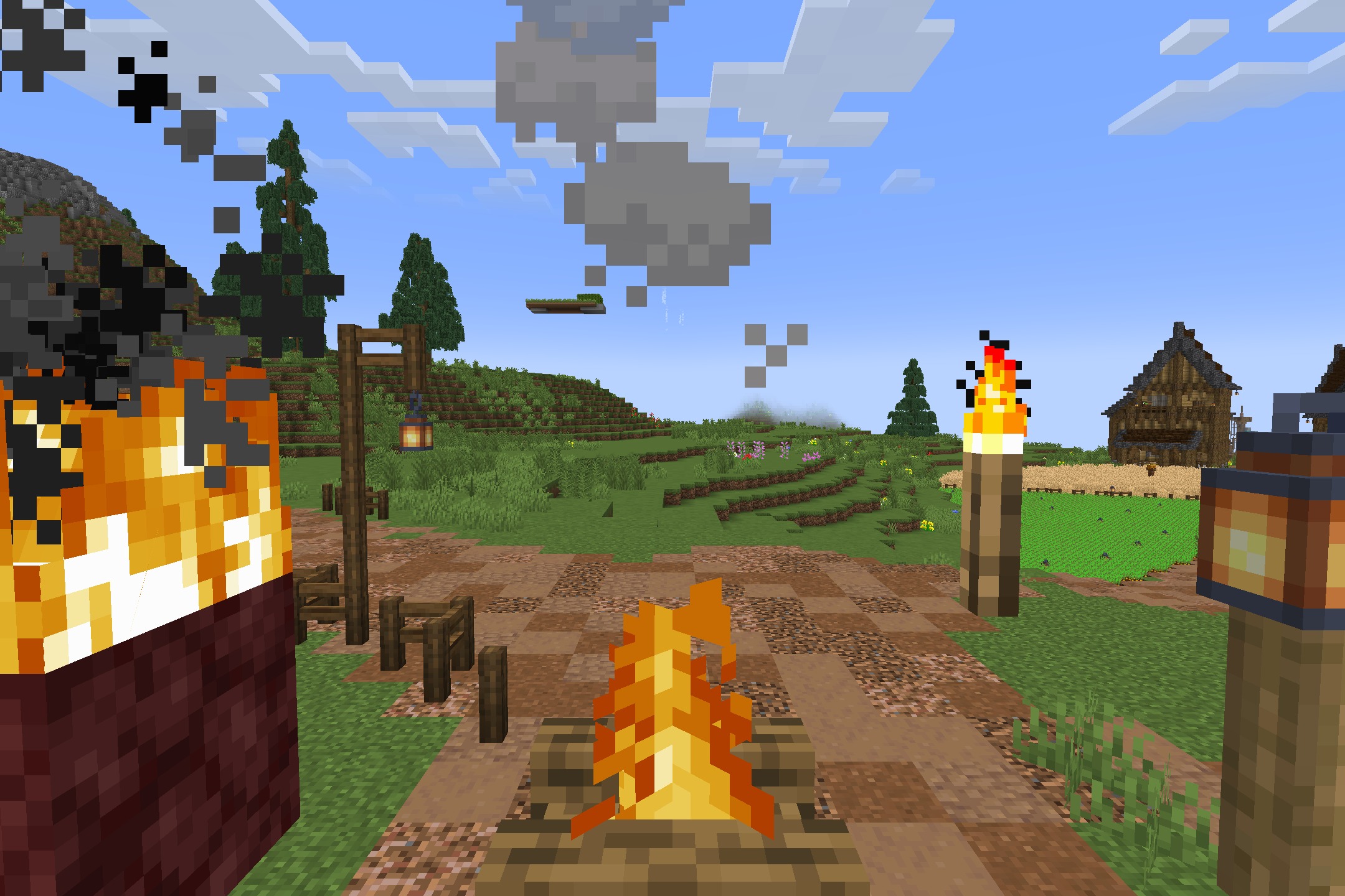 BwW Resource Pack Screenshot 4 Campfire and lanterns lighting a rustic dirt path near a small medieval wooden house