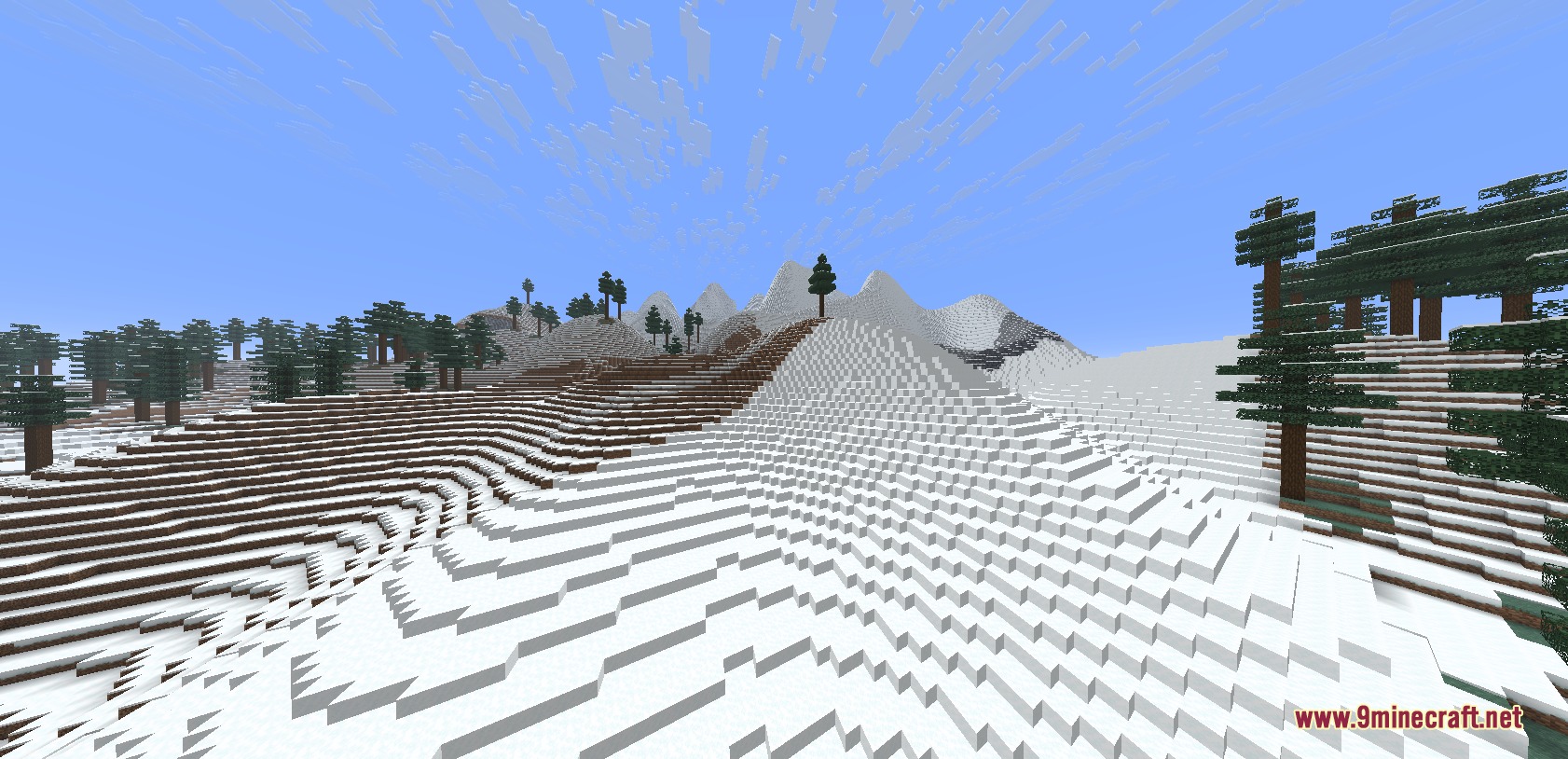Canyons and Cliffs and Biomes Mod Screenshot 5 A massive snow covered mountain range with tall spruce trees in Minecraft