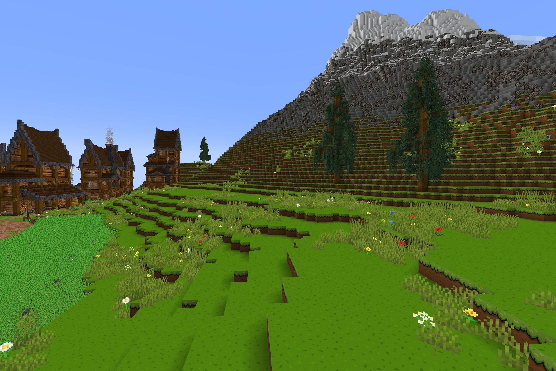 CartoonCraft Resource Pack Screenshot 4 A large mountain and green hills featuring smooth and bright cartoon textures