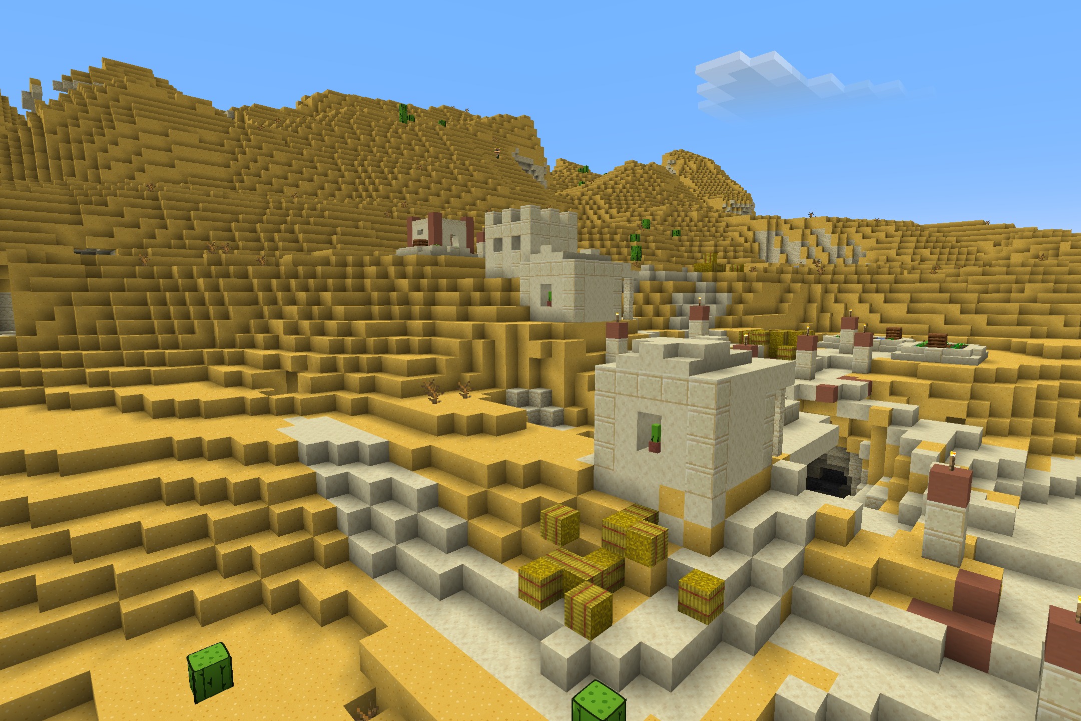 CartoonCraft Resource Pack Screenshot 5 A bright desert village with sandstone houses and hay bales in cartoon style